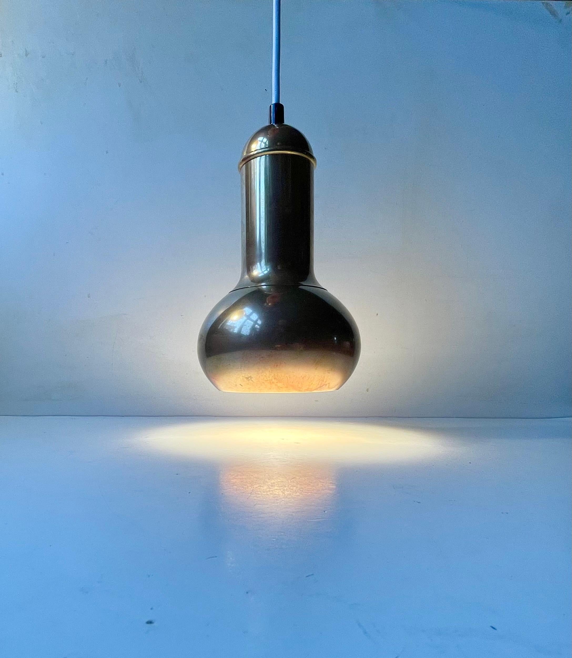 A fallos shaped solid brass pendant lamp made and designed by Frandsen Belysning in Denmark circa 1970-75. Stylistically its inspired by earlier pieces by Tynell and Lisa Papé Johansson. It measures 23 cm in height and has a diameter of 14 cm.