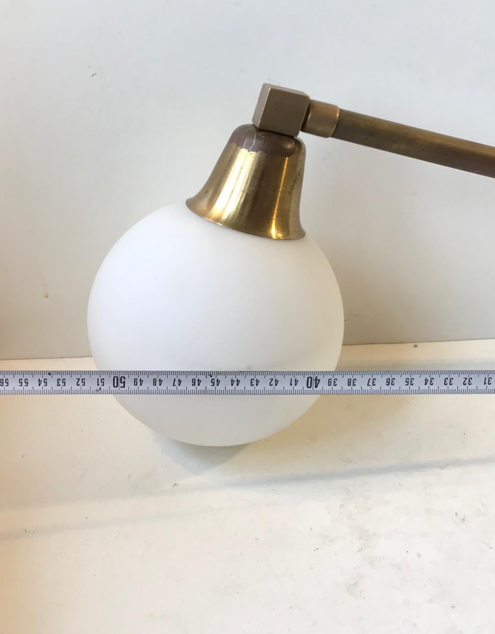 Mid-20th Century Scandinavian Modern Brass Swing Arm Wall Sconce with Opaline Sphere, 1960s For Sale