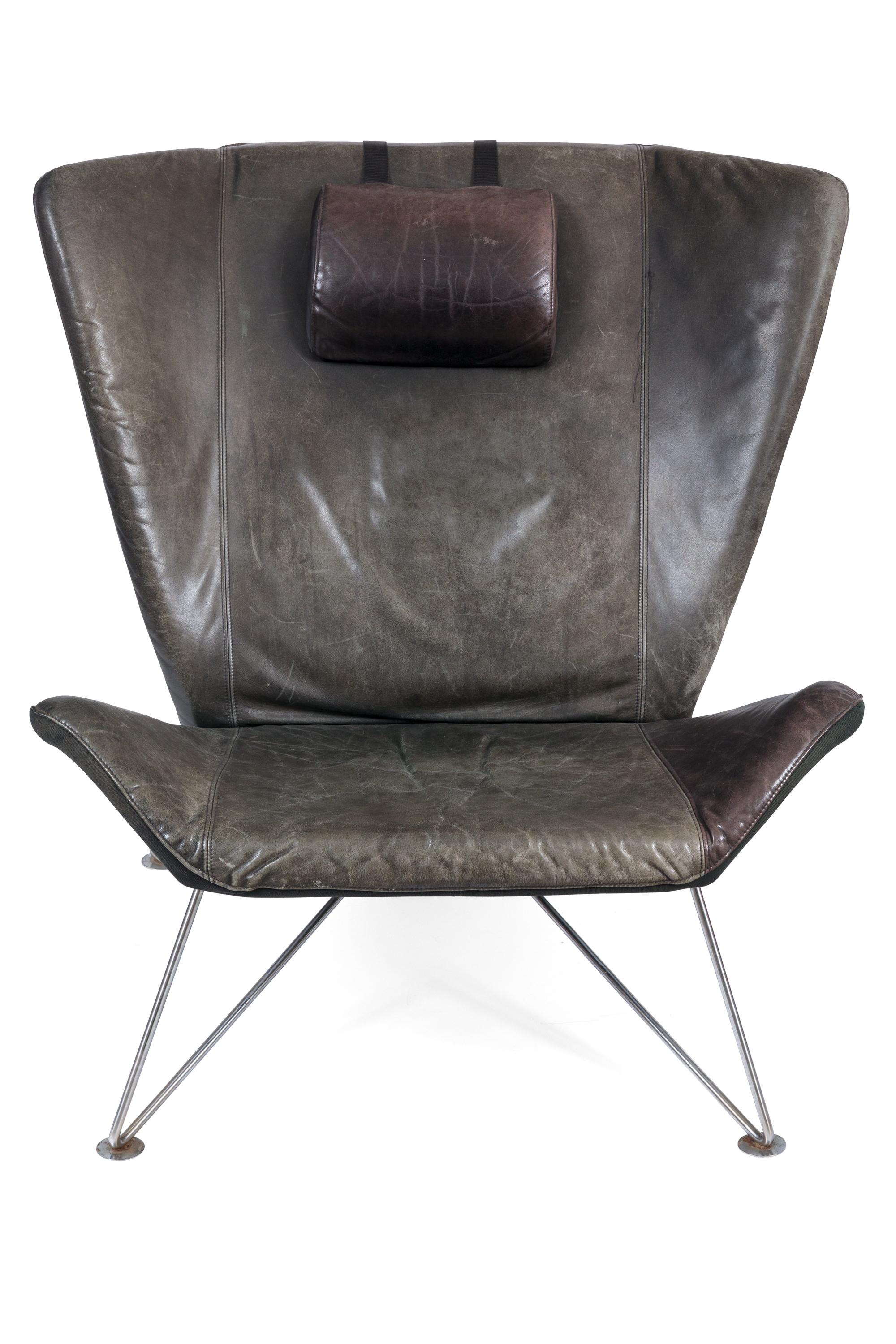 We haven't been able to identify the designer of these chairs but they are fabulous. The steel base has a great architectural design and the overall look of the chair is distinctive yet still reminiscent of many classic Scandinavian Modern chairs.
