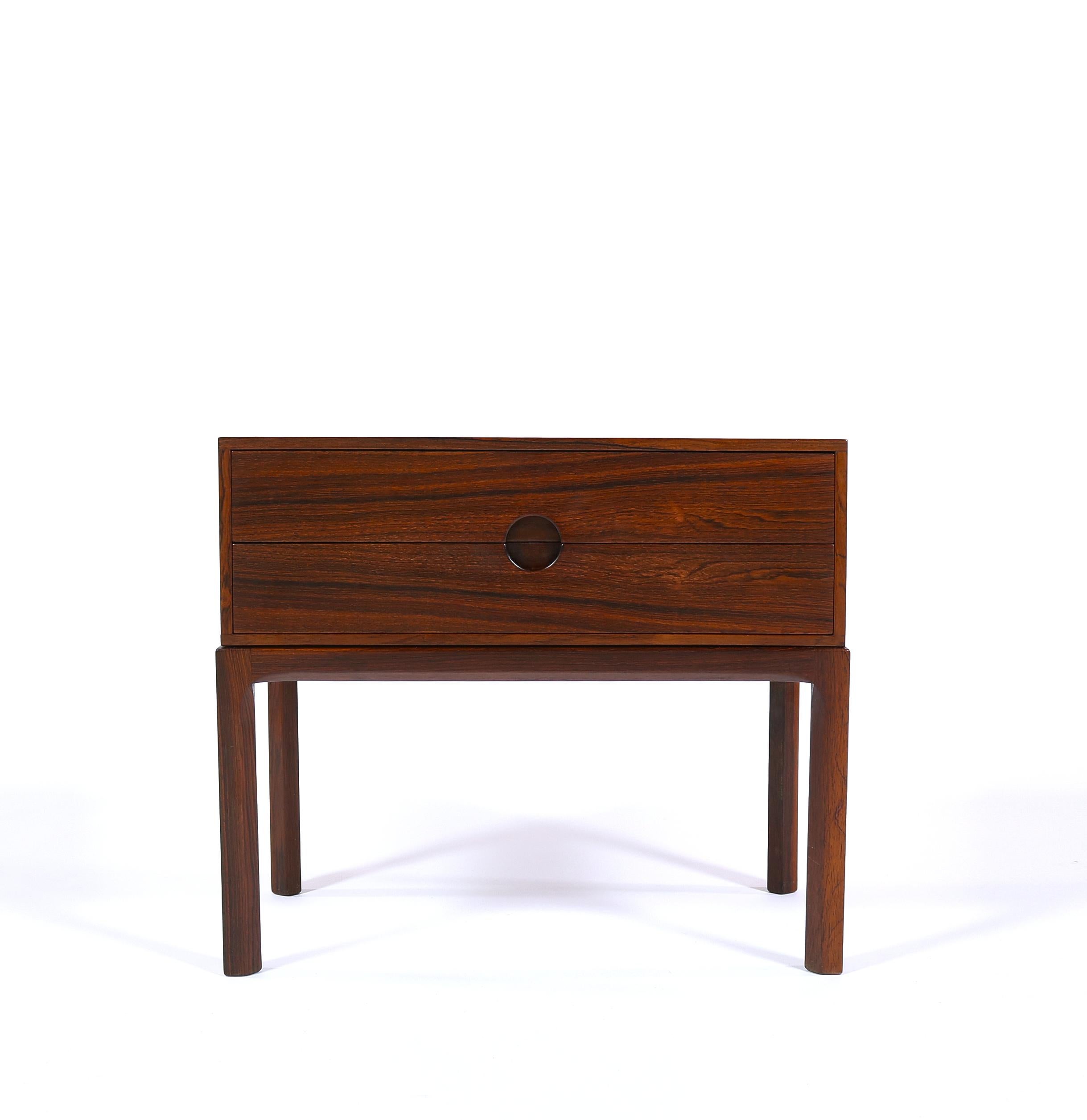 Kai Kristiansen cabinet made, circa 1960. Produced by cabinetmaker Aksel Kjaersgaard in Odder, Denmark. The cabinet has 2 drawers with Kristiansen's trademark circular drawer pull to the center. Great condition with very few signs of wear.