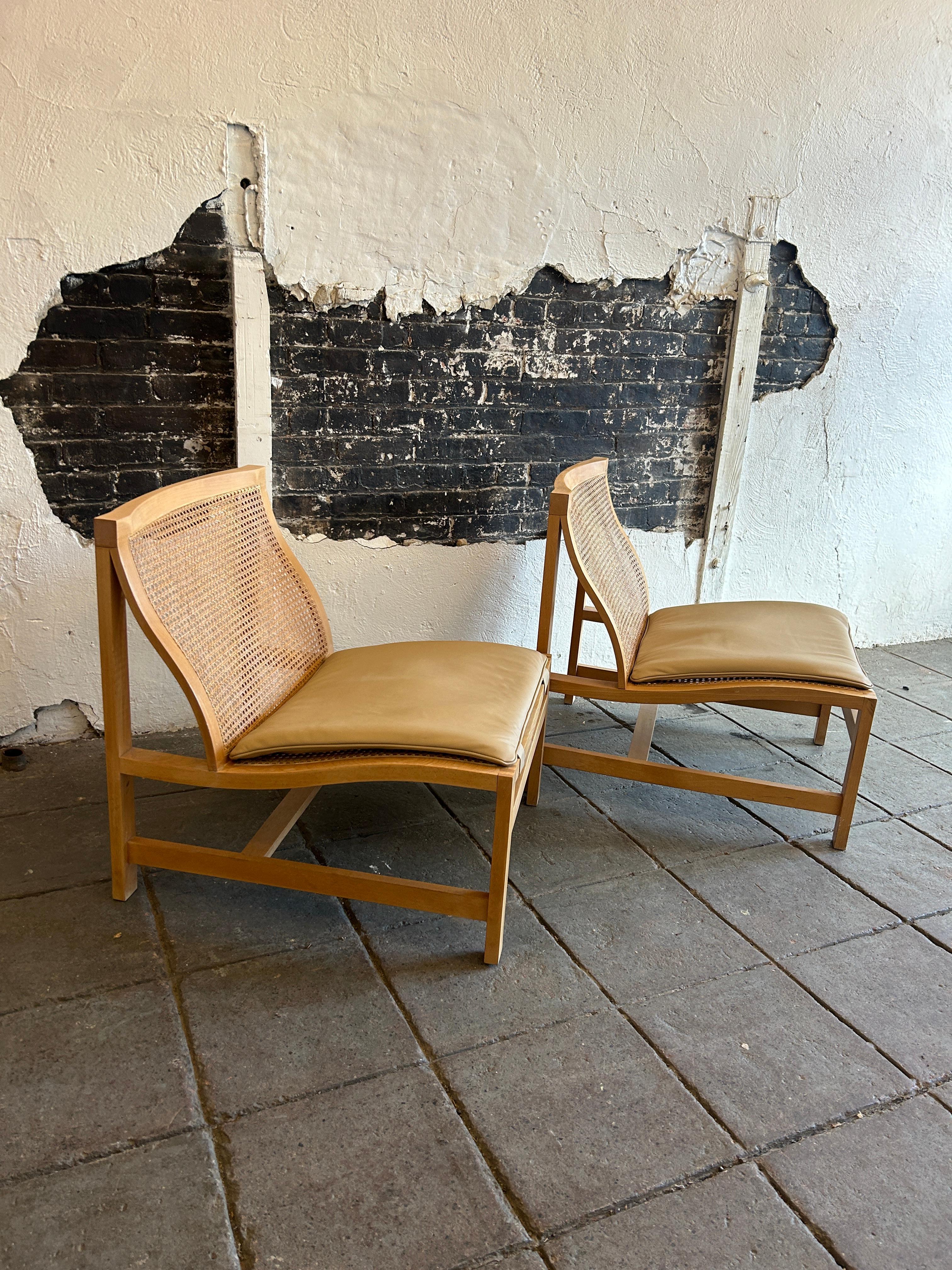 Scandinavian modern Cane Birch Leather lounge chairs. Beautiful design solid birch with cane seat and seat back. Has tan leather removable seat cushion. All cane is in excellent condition very sturdy well built chairs. Designed by Rud Thygesen and