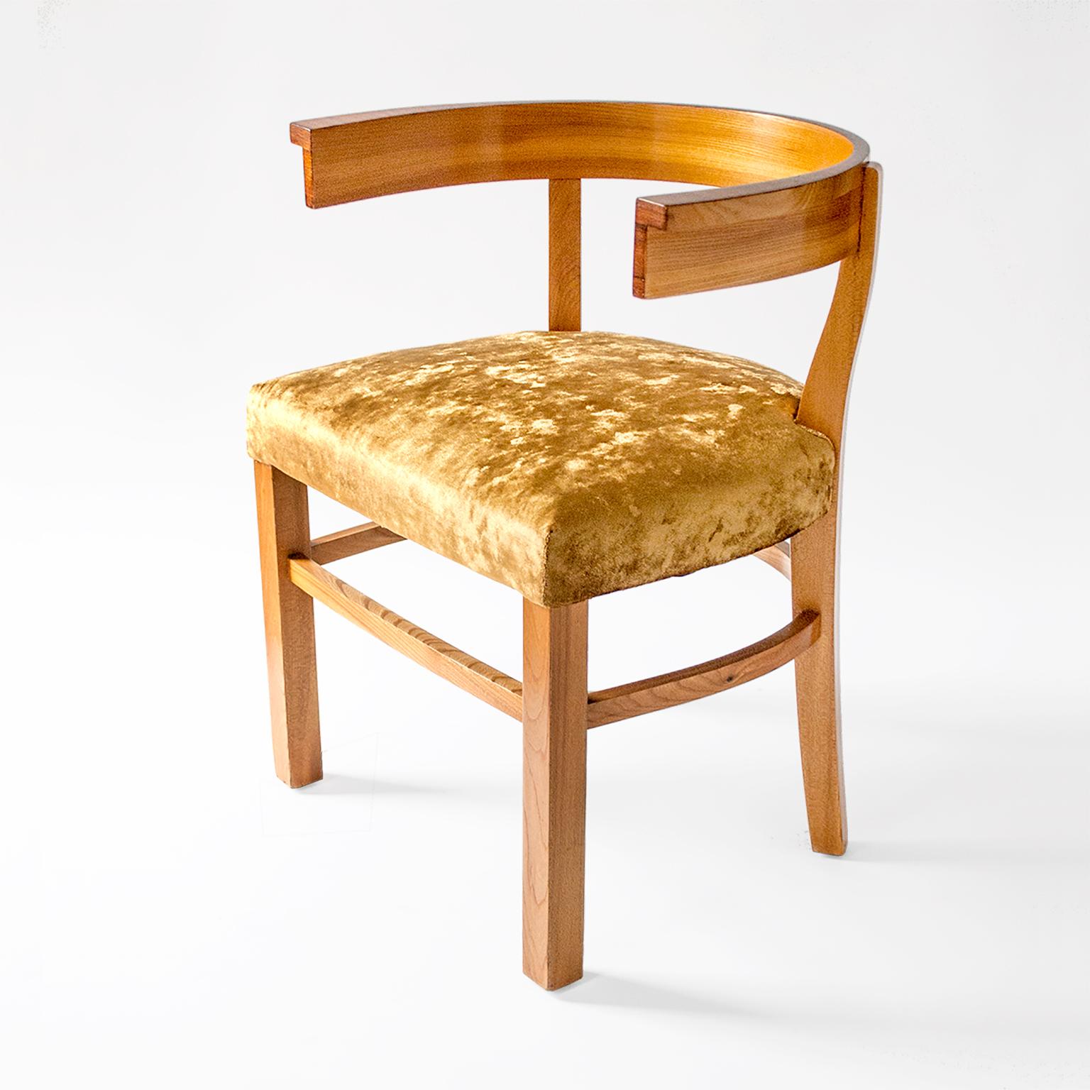 Fine Swedish art deco chair in elm with upholstered seat. The chair features a curved 