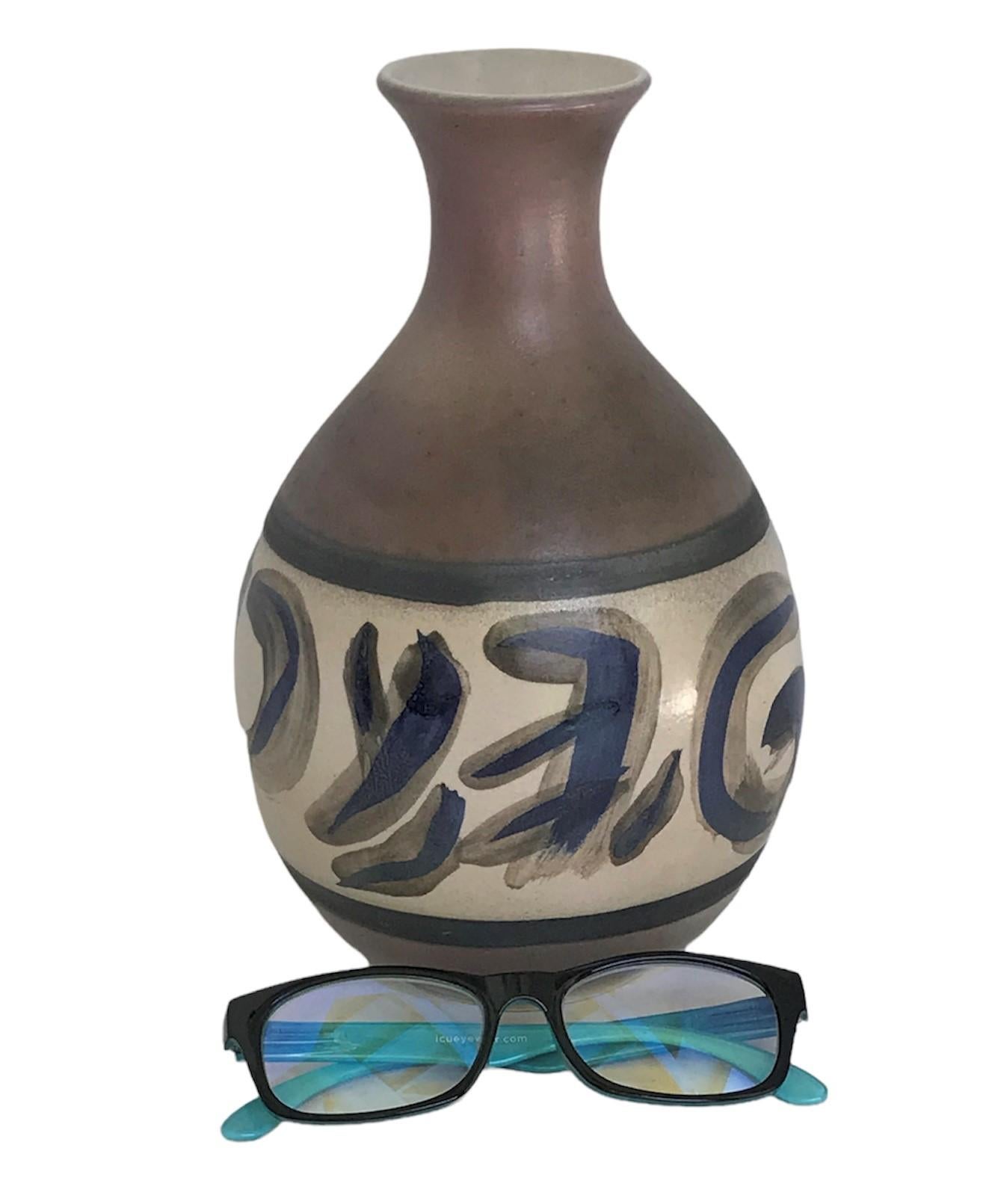 A rare, hand-signed and large “Sorne” Vase by Swedish ceramicist Carl-Harry Stålhane for Designhuset, Sweden. A big bellied form with a neck spout, it is painted underglaze brown with a centered area with abstract symbols, circles and shapes.

In