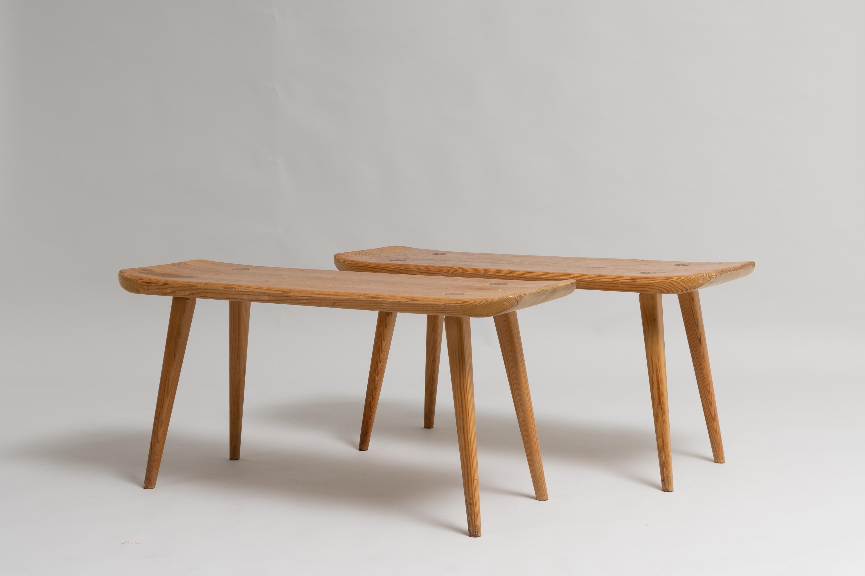 Set of 2 stools Visingsö by Carl Malmsten för Svensk fur. The stools are solid pine with beautifully curved characteristic edges. Designed in 1953. This pair is from around 1965 and are branded underneath the seat. Good vintage condition consistent