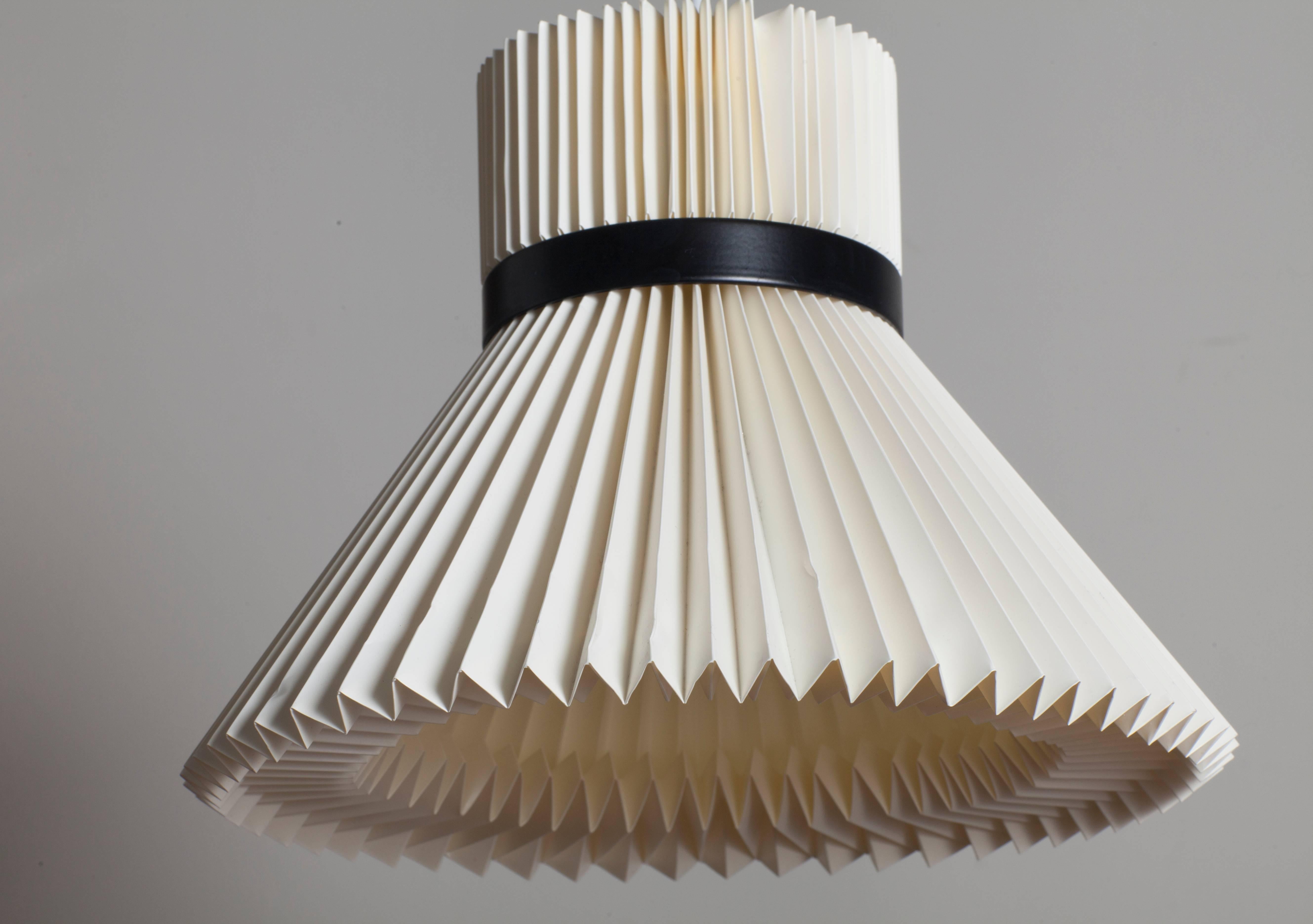 Ceiling lamp Danish classical Le Klint brand. The lamp is made of hand-molded plastic. The black rim is made of metal. The electrician is replaced. The lamp has an interesting design, well scatters the light.