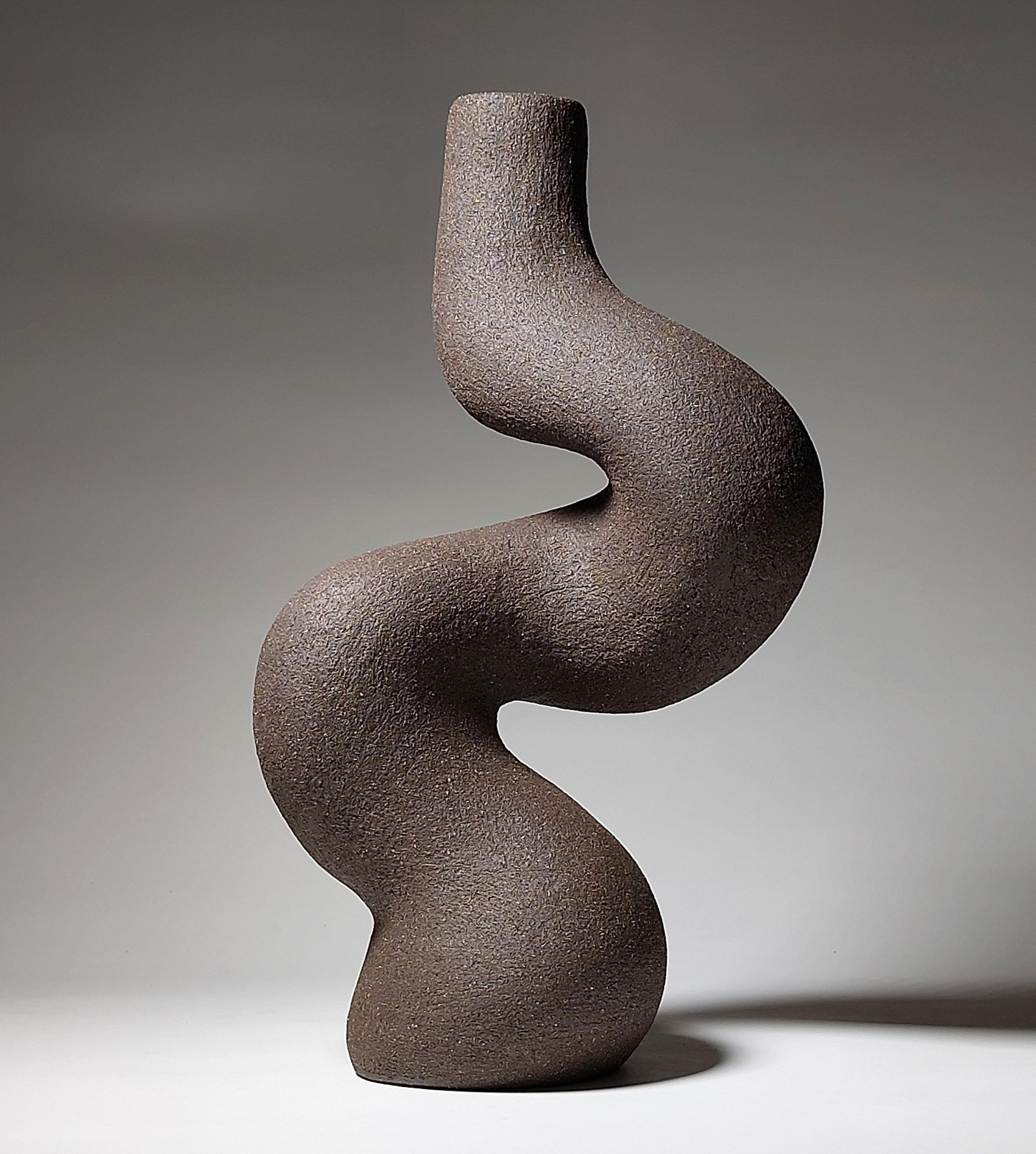 Contemporary Black Stoneware Ceramic Candlestick by Rachel Peters, Unglazed, In Stock.

This Candlestick has been hand built from Medium Vulcan Black Stoneware Clay using the traditional method of coiling.   Refined and finished by hand to create a