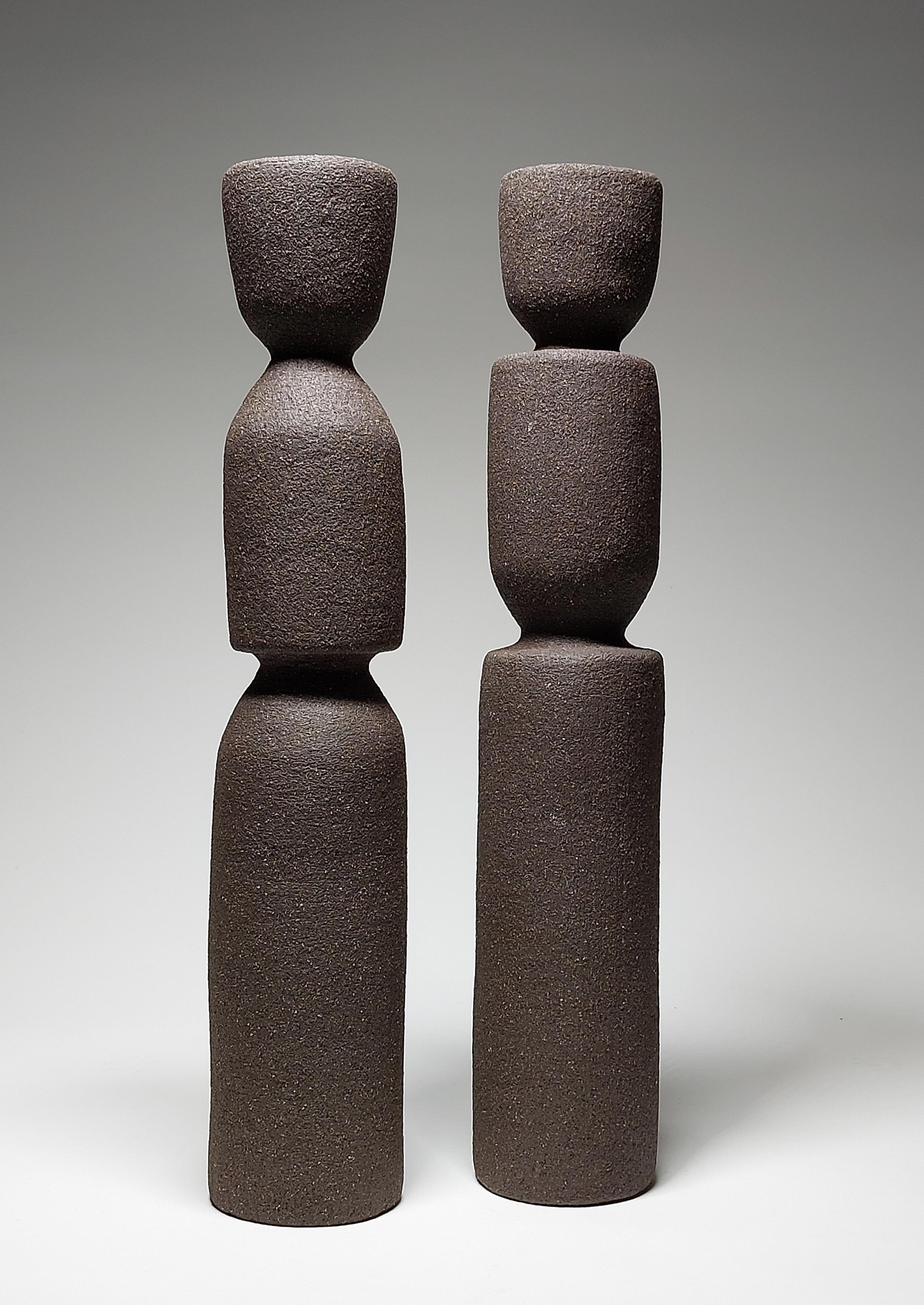 Contemporary Black Stoneware Ceramic Candlesticks by Rachel Peters, Unglazed Clay, In Stock.

This pair of Candlesticks have been hand built from Medium Vulcan Black Stoneware Clay using the traditional method of coiling.   Refined and finished by