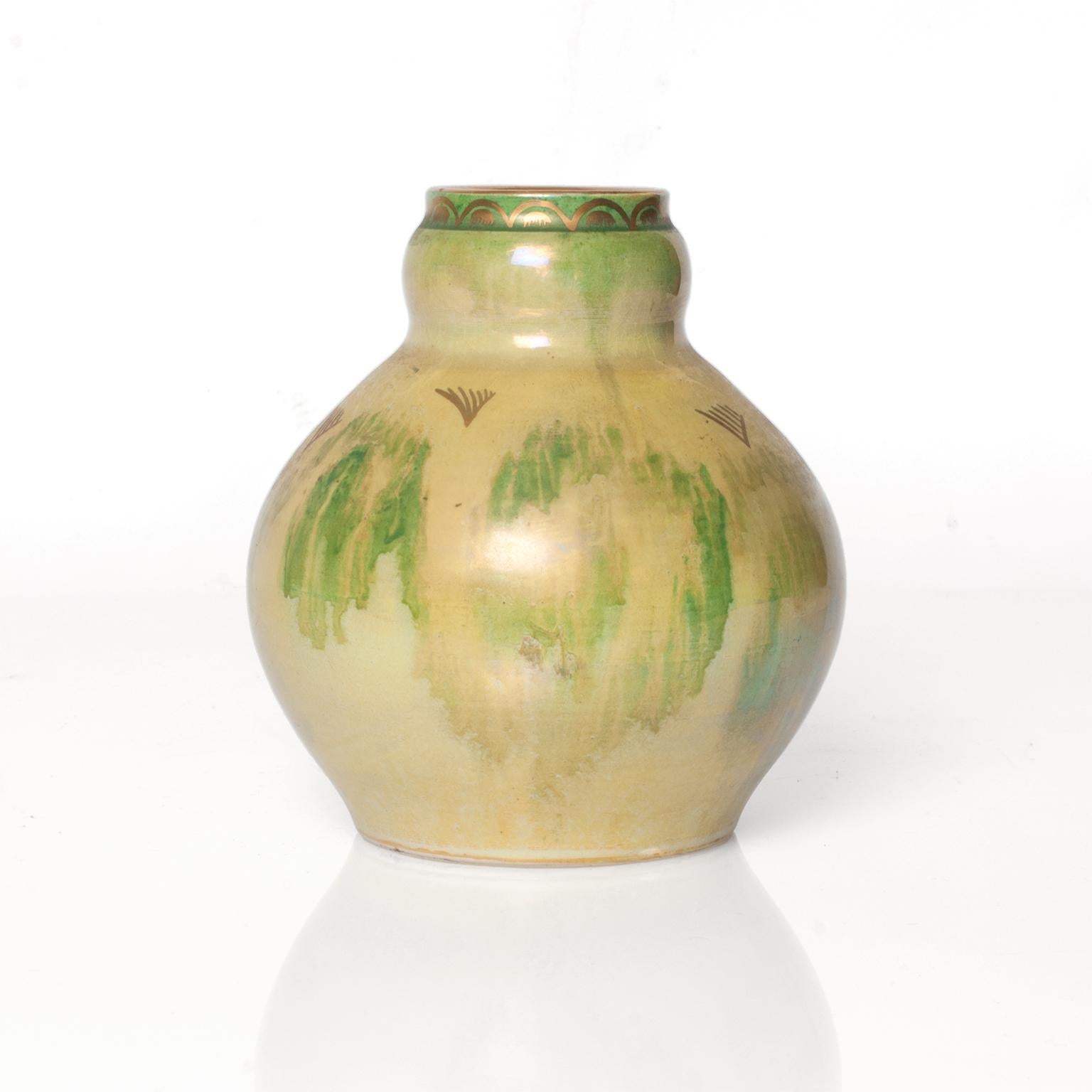 Scandinavian Modern, Swedish Art Deco, hand decorated ceramic vase from Gustavsberg. Designed and signed by Josef Ekberg, 1930s, in pale green luster glaze with details in gold.
 
Measures: Diameter 5.75