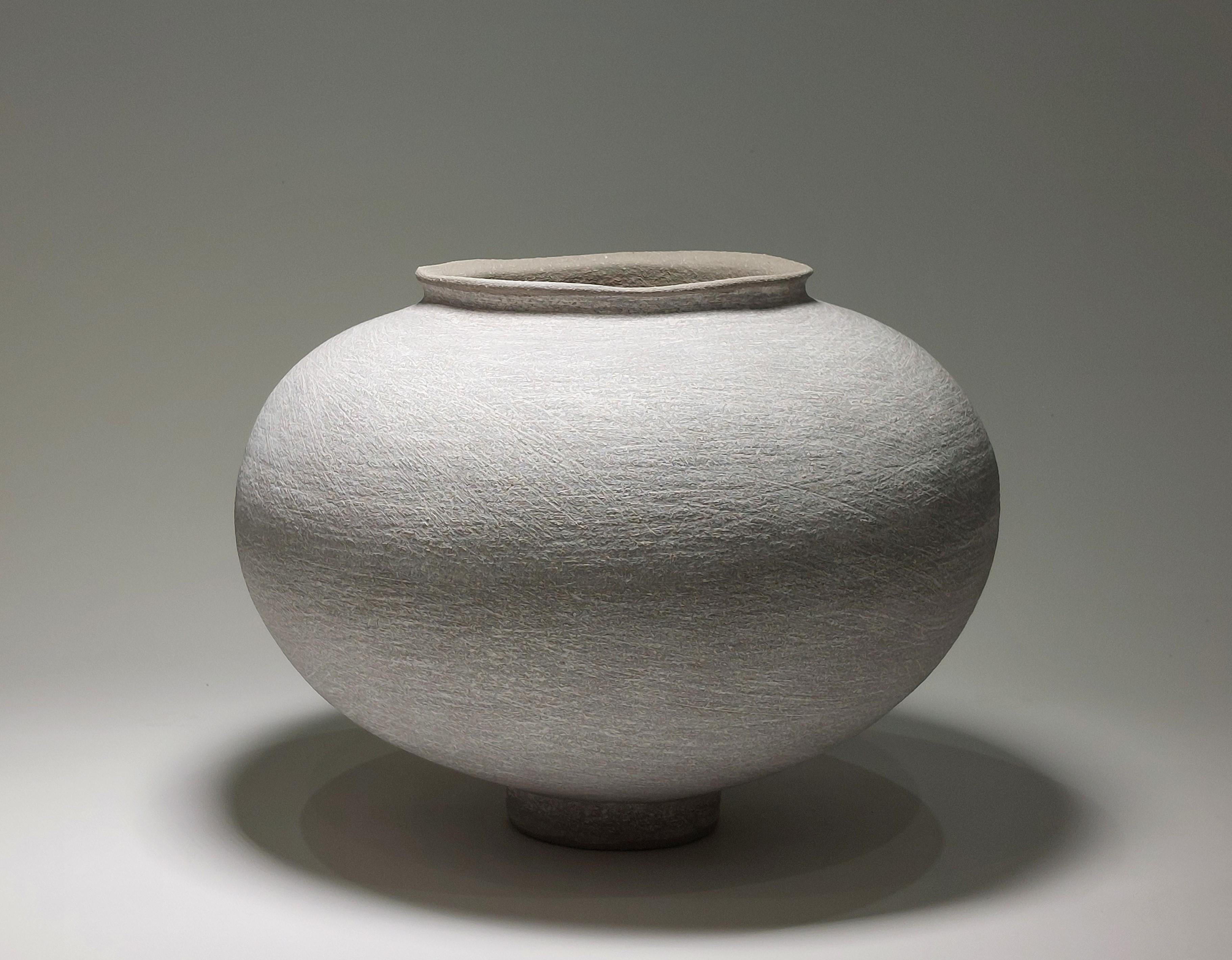 Contemporary Grey Stoneware Ceramic Vessel by Rachel Peters, In Stock.

This vessel has been hand built from Rokk Grey Stoneware Clay using the traditional method of coiling.   Refined and finished by hand to create a beautiful tactile surface and