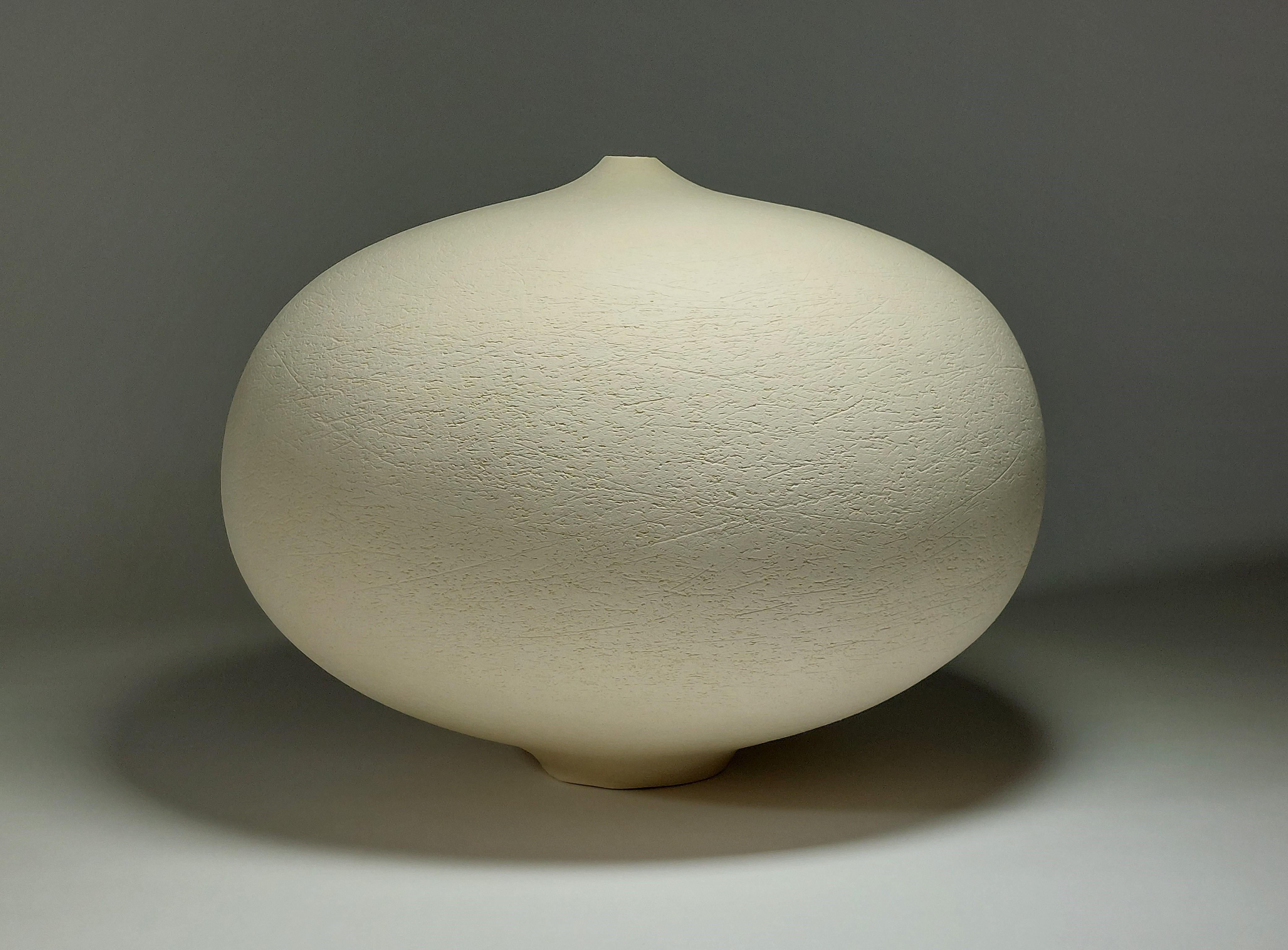 Contemporary White Stoneware Ceramic Vessel by Rachel Peters, In Stock.

This vessel has been hand built from Ashraf Hanna Clay using the traditional method of coiling.   Refined and finished by hand to create a beautiful tactile surface.  This