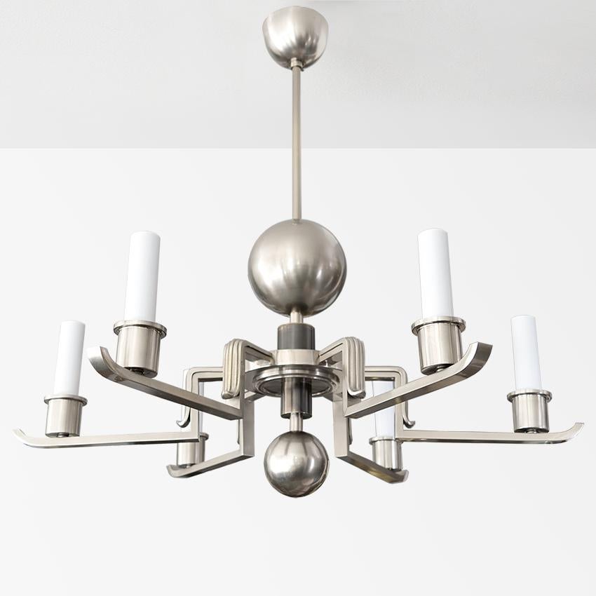 Scandinavian Modern nickel-plate over brass six-arm chandelier with large and smaller spheres. Each arm has a candle sleeve with a newly rewired standard base socket ready for use in the USA. Probably made by Bohlmarks. 
 
Measures: Height 28