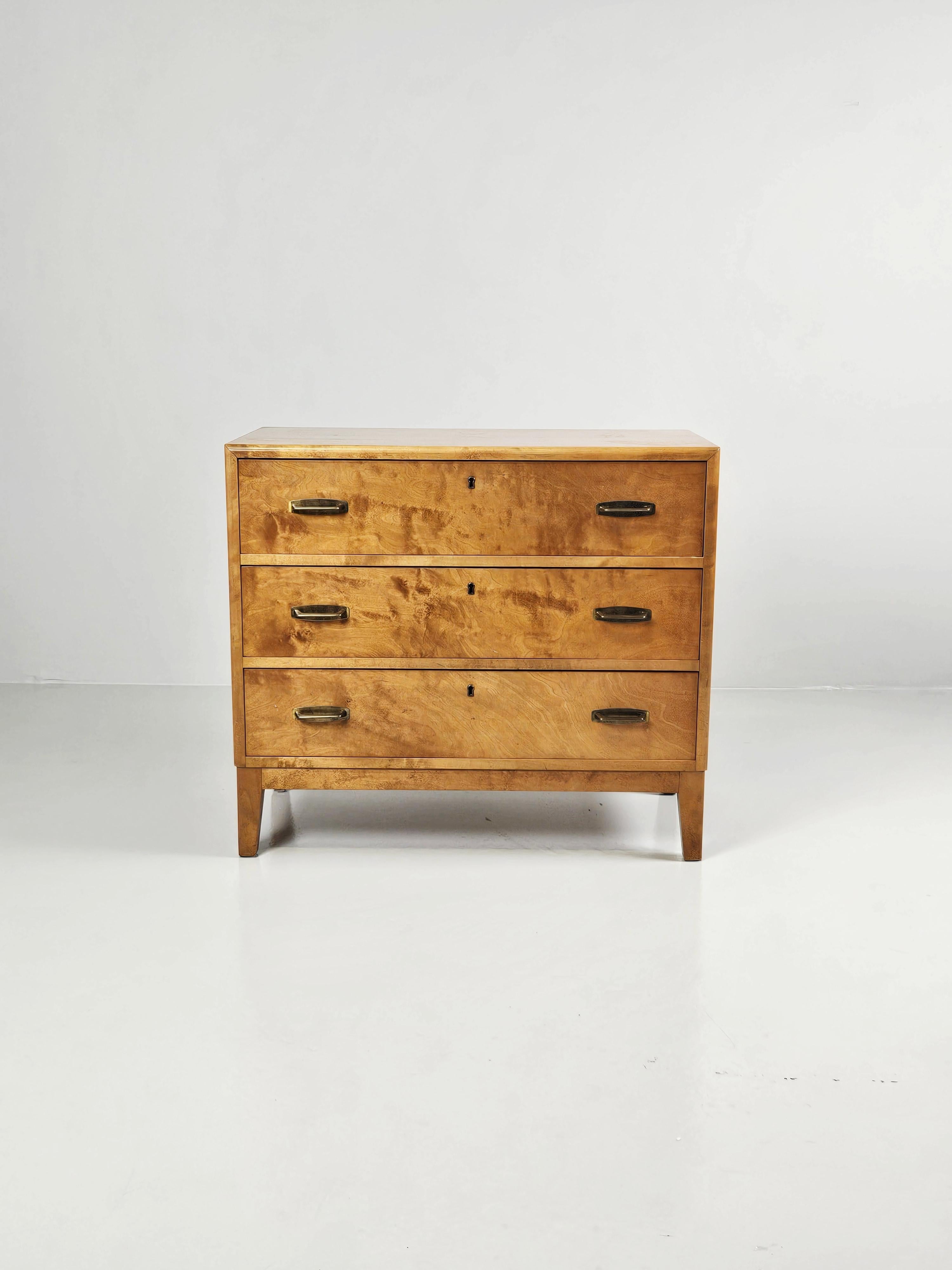 Great functionalistic chest of drawers produced in Sweden during the 1950s. 

Made in birch with brass handles. 