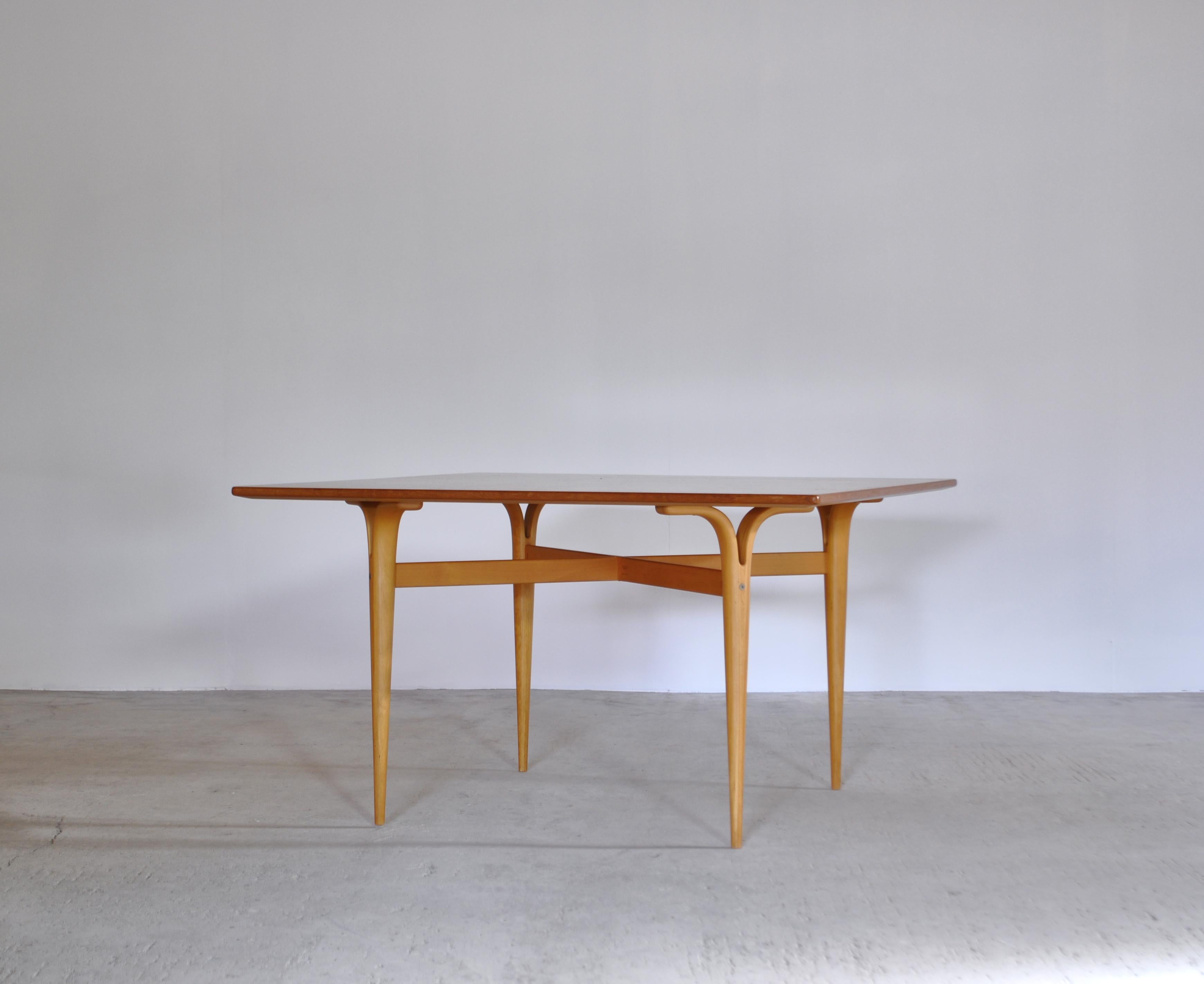 A fine and early example of Bruno Mathsson’s “cleft-leg” table in the square. Designed in 1948, this model was produced by 