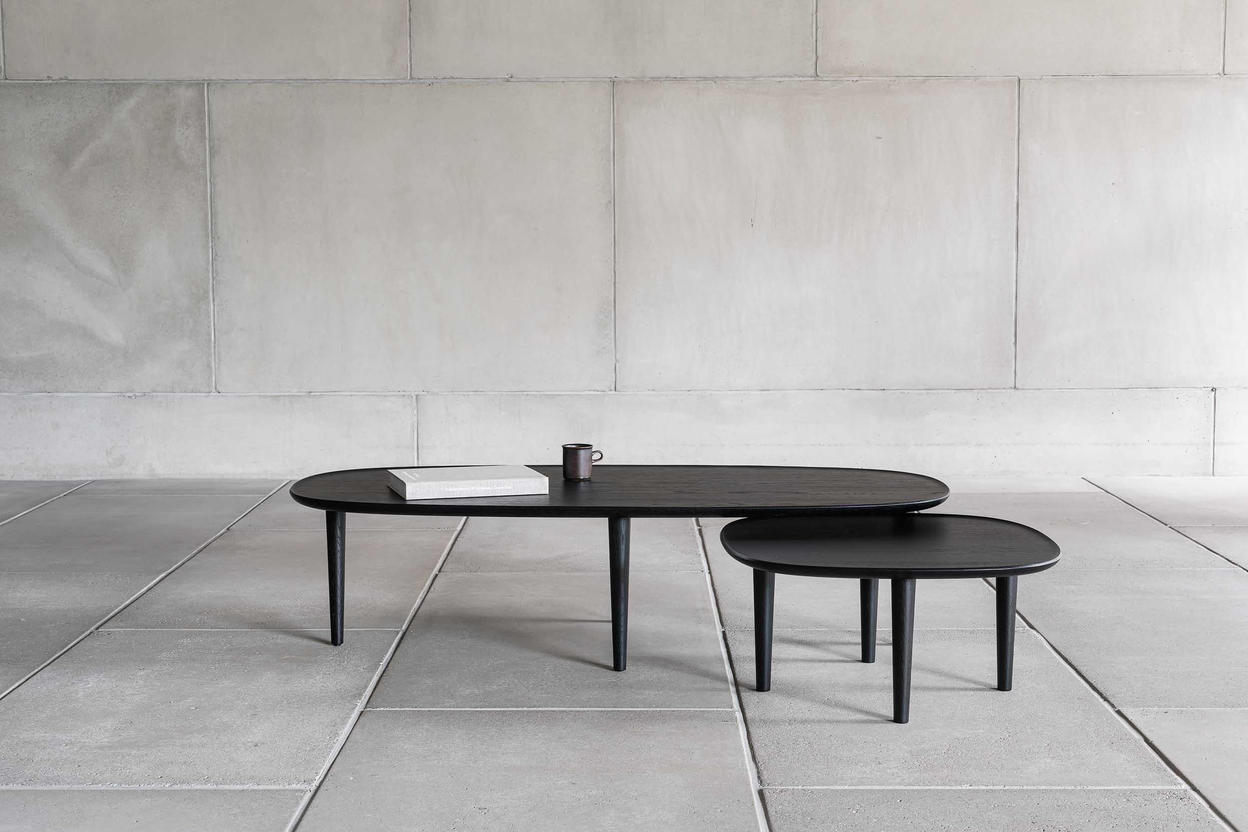 Fiori table 140 designed by Antrei Hartikainen x Poiat
Fiori Collection 2017

Available finishes: 
- Oak
- Dark oak 
- Black oak

Model shown in picture : 
- H. 35 x 140 x 65 cm
- Black Oak

Designed by Poiat Studio in collaboration with