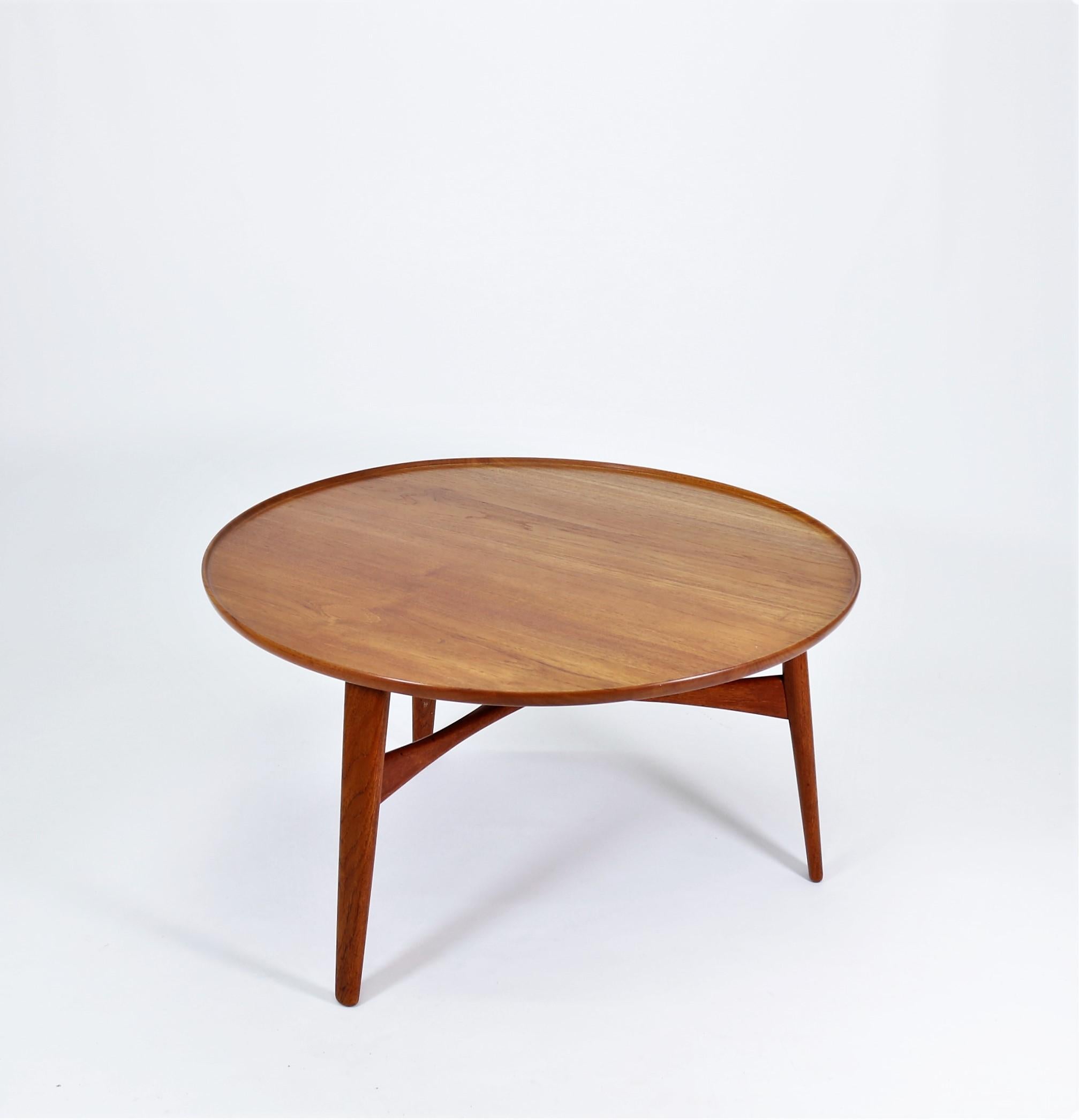 Rare and stunning three legged coffee table in solid teak wood handcrafted by famous Danish Cabinetmaker Willy Beck in 1953, Copenhagen. The table was designed by Danish architects Aksel Bender Madsen & Ejnar Larsen and was exhibited at the Danish