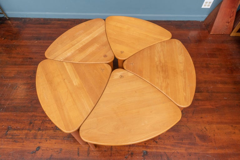 Scandinavian modern design stacking tables that configure into a round coffee table. Appealing design that is both functional and space efficient, perfect for a casual living envoirment for families. Tables show signs of use and wear and slight