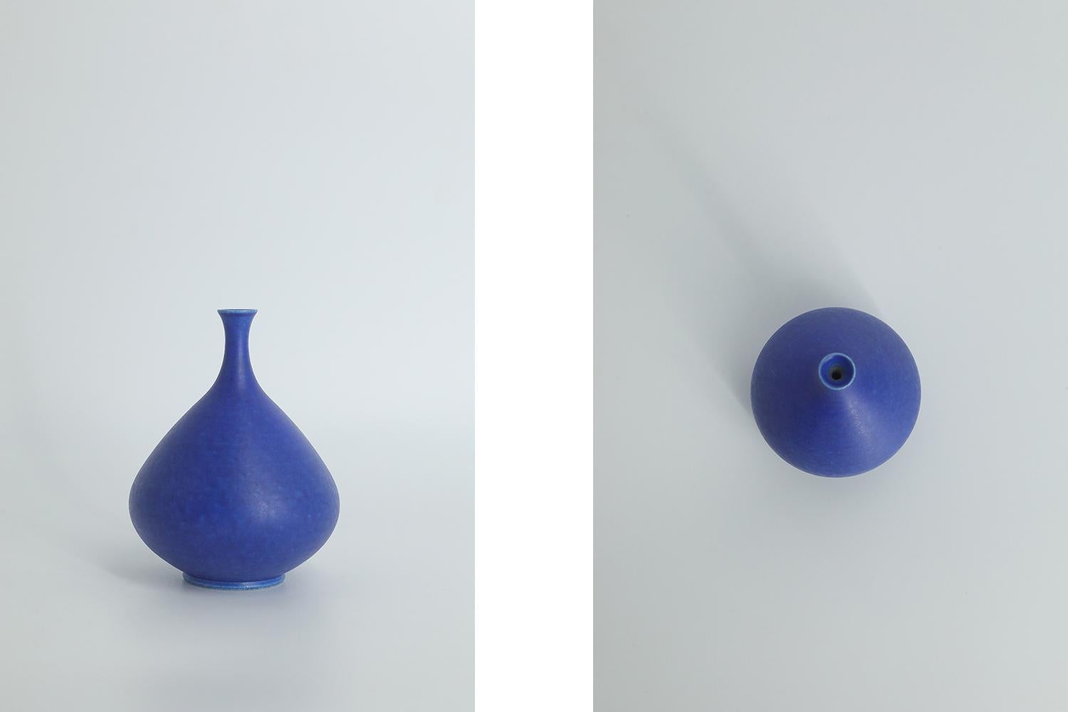 This miniature, collectible stoneware vase was designed by Gunnar Borg for the Swedish manufacture Höganäs Keramik during the 1960s. Handmade by a Master, with the utmost care and attention to details. The cobalt blue colored vase. Signed with the