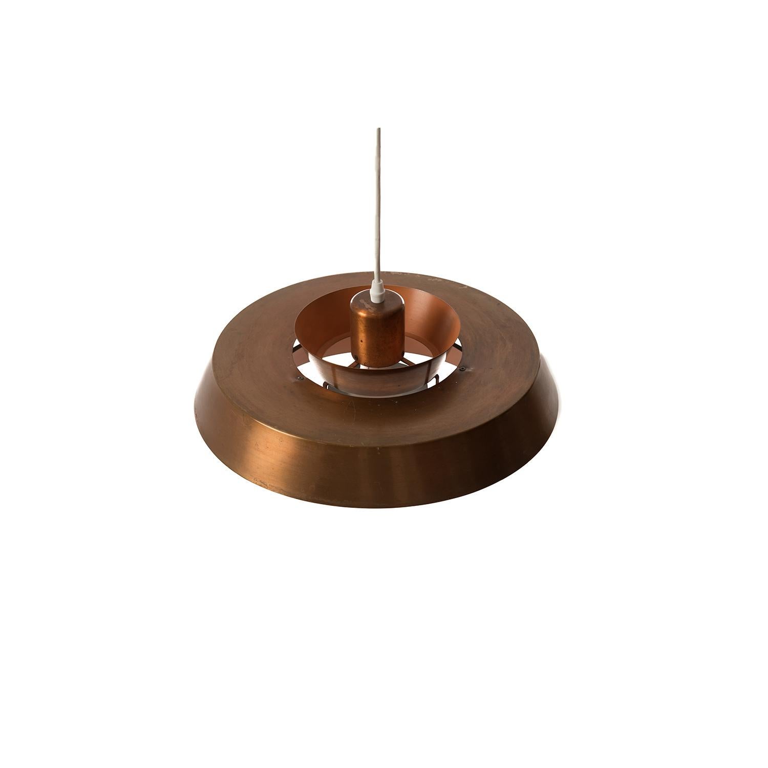 Multi-tier pendant fixture in patinated copper, casts a warm glow in any space, so cool season, and so much more emotionally satisfying than a pumpkin spice latte! This pendant has been updated with North American socket and wiring.