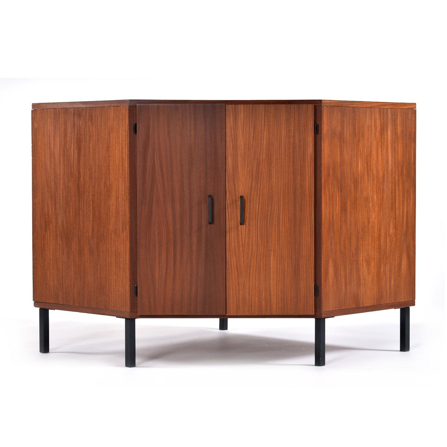 Incredibly unique Mid-Century Modern corner media cabinet. This piece is a real outlier. The cabinet deviates from peers of its vintage, 1950s / 1960s. It’s minimalist design and exotic hard wood construction suggests Scandinavian origins, however
