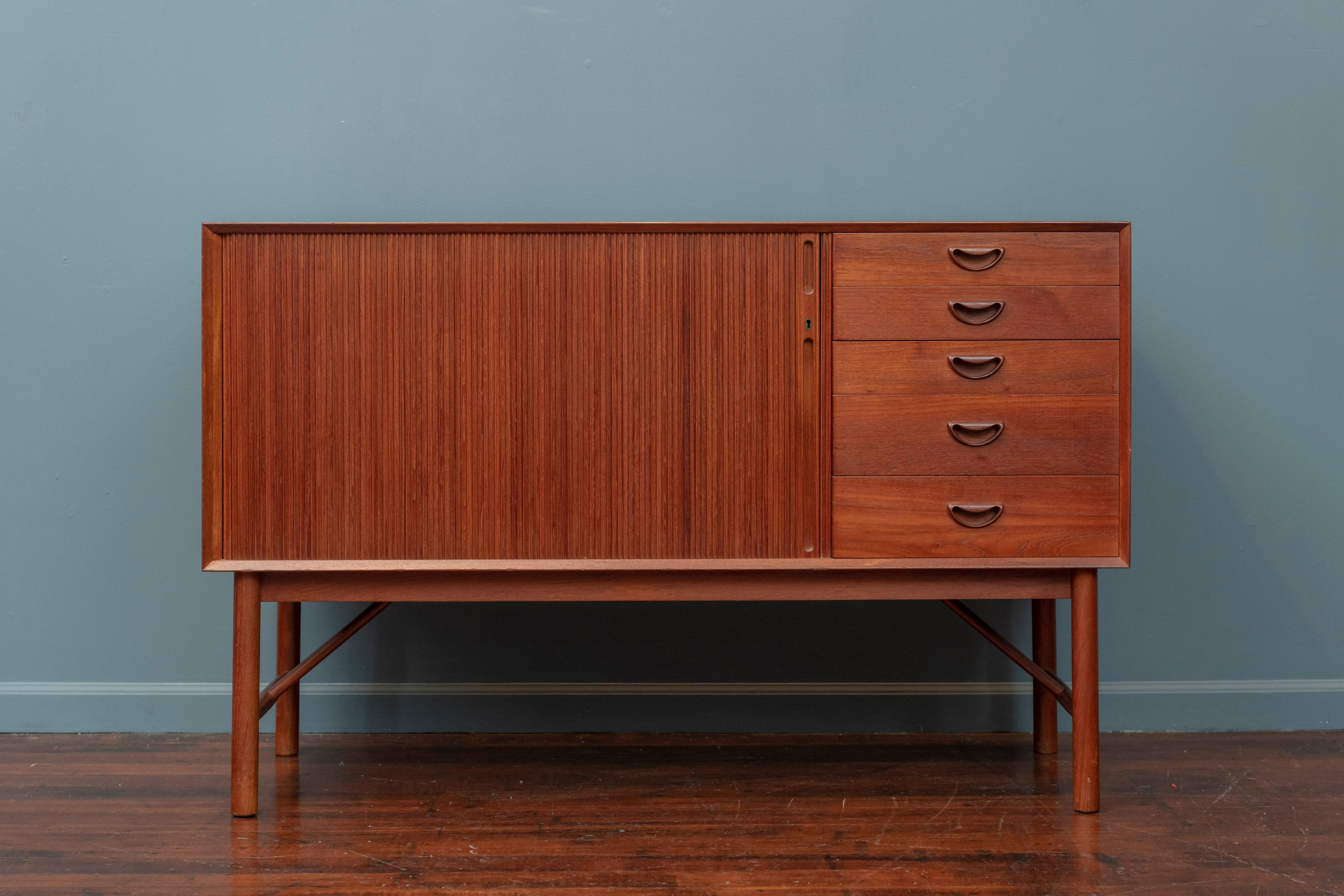 Scandinavian Modern teak credenza designed by Peter Hvidt &Orla Moregaard. High quality construction and attention to detail made from solid teak with finger joinery and newly refinished.