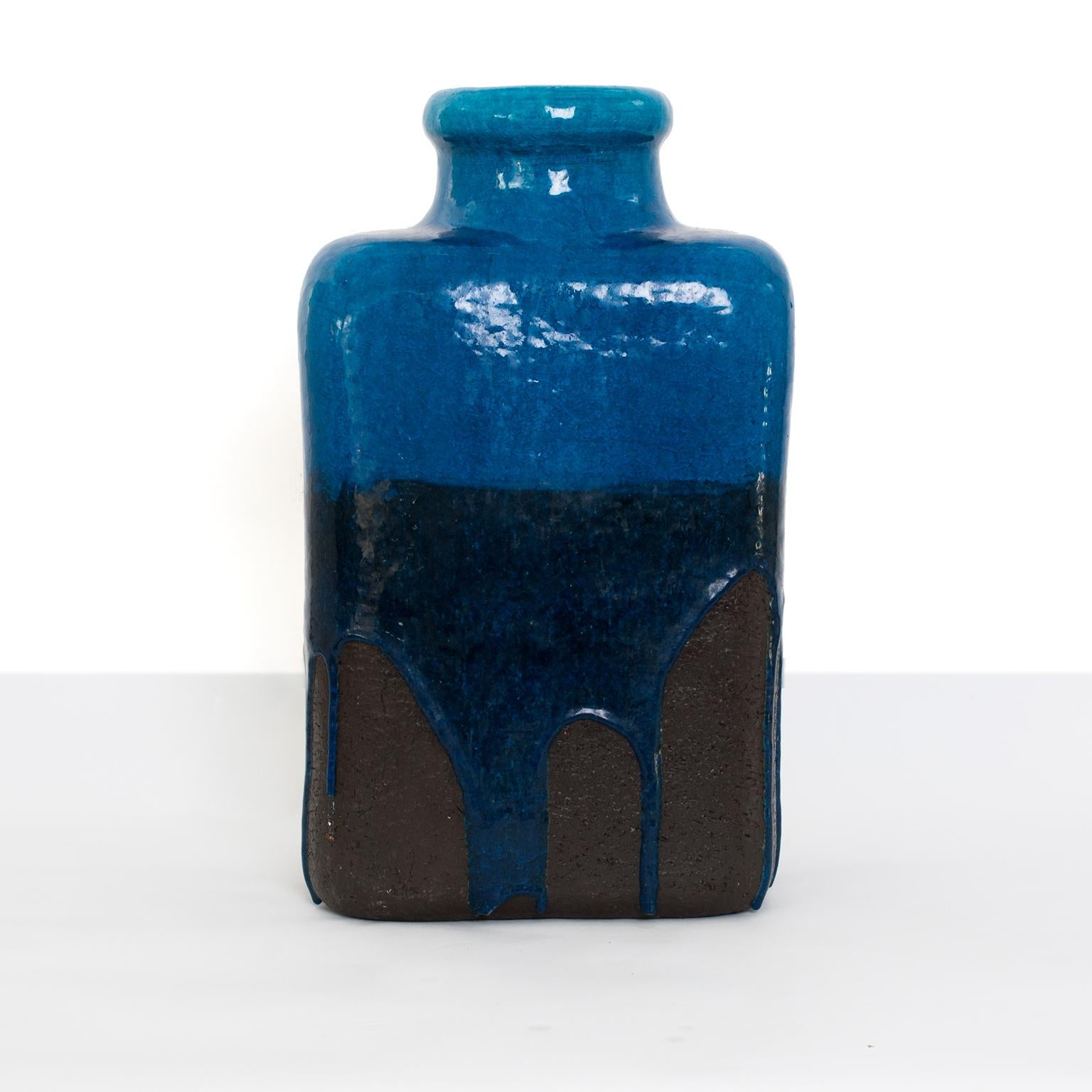 Massive Scandinavian Modern ceramic vase from Denmark. The vase is partially glaze in a deep blue color over a dark earthy brown clay with drips on all sides. Measures: Height 19.5