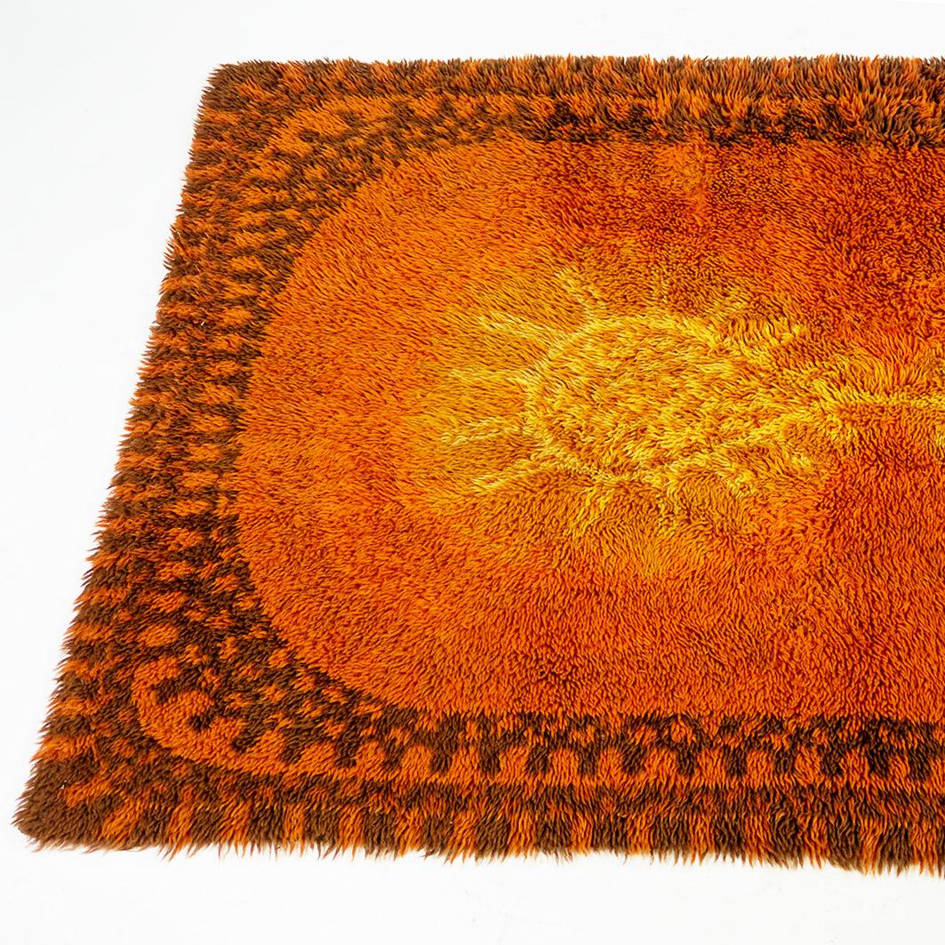 This Scandinavian high pile rug has been designed and produced in Denmark 1960s.
Charming and very decorative graphic design carpet in wonderful shades of orange and yellow. Looks fantastic with brown teak, oak or rosewood furniture! great highlight