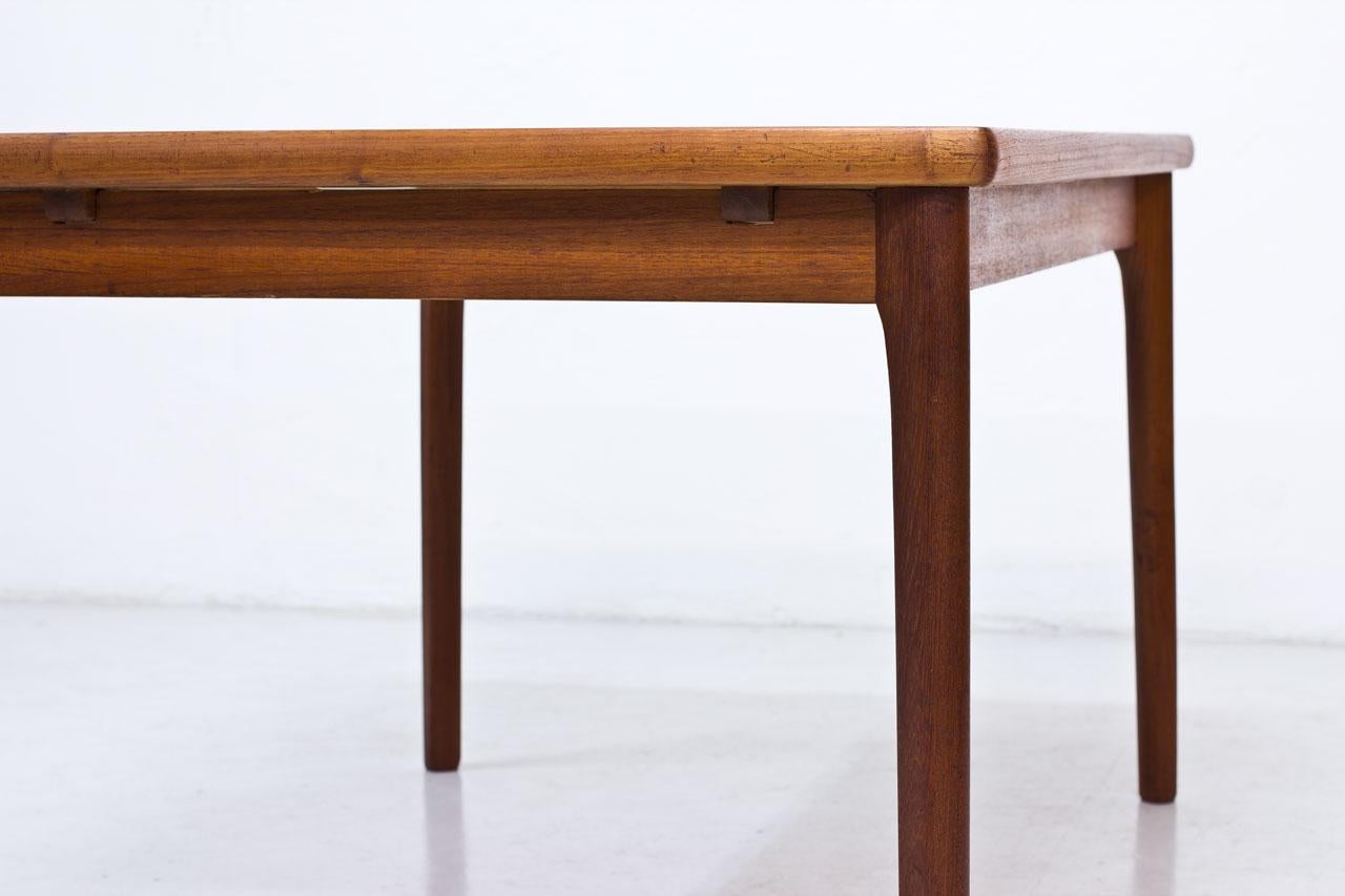 Scandinavian Modern Danish Teak Extendable Dining Table by Henning Kjærnulf 7