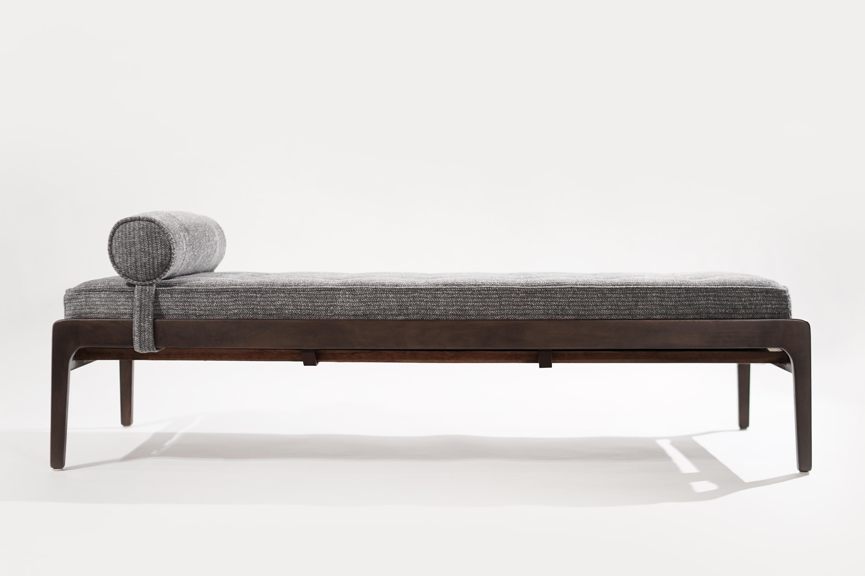 A stunning Scandinavian-Modern daybed or bench, Denmark, 1950-1959. Walnut frame completely restored, newly upholstered on grey twill with tufted details.

Other designers of the period include, Finn Juhl, Kaare Klint, Hans Wegner, Gio Ponti, and