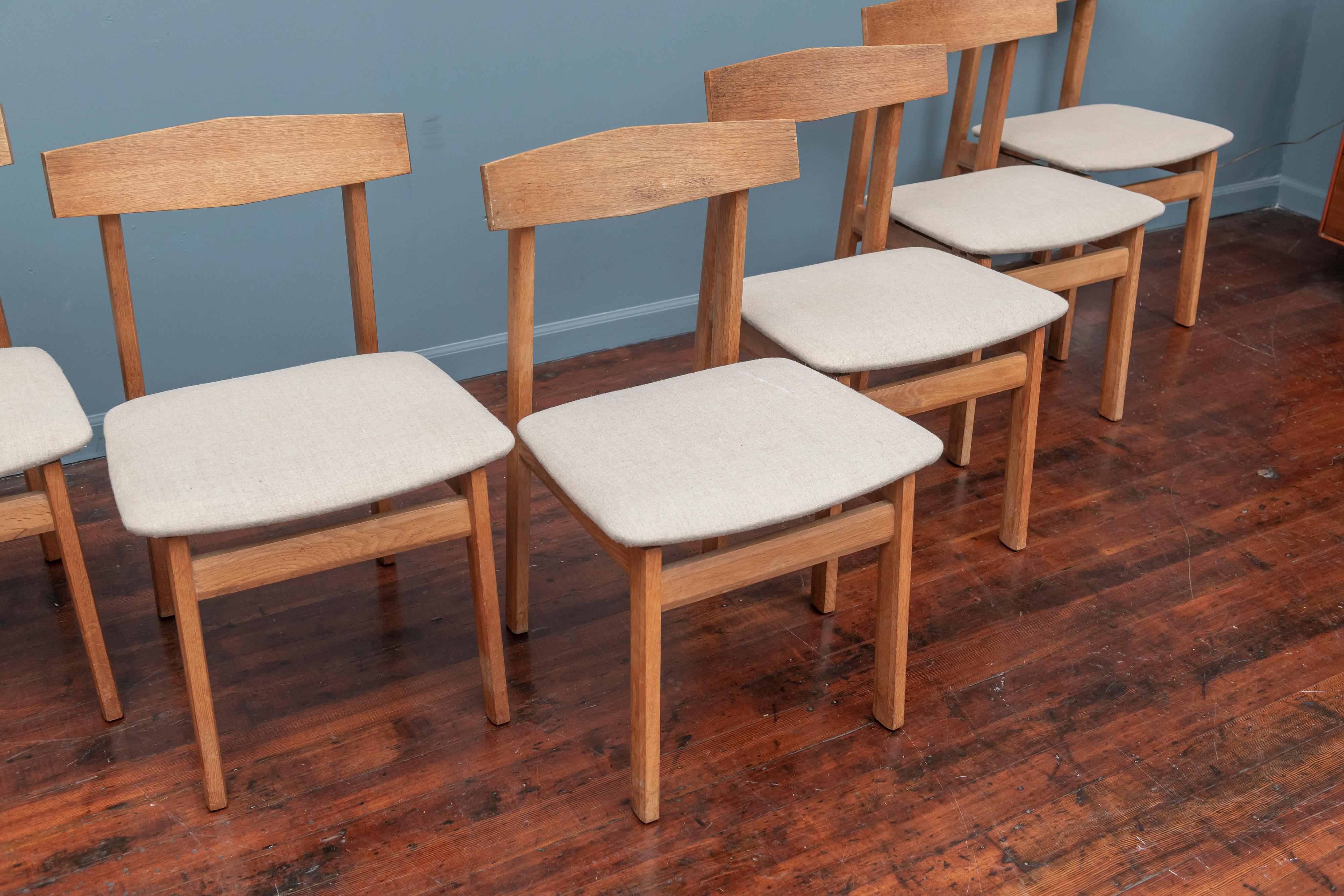 Scandinavian Modern oak dining chairs, Sweden. Interesting minimalist design with angular edge details to the frames.