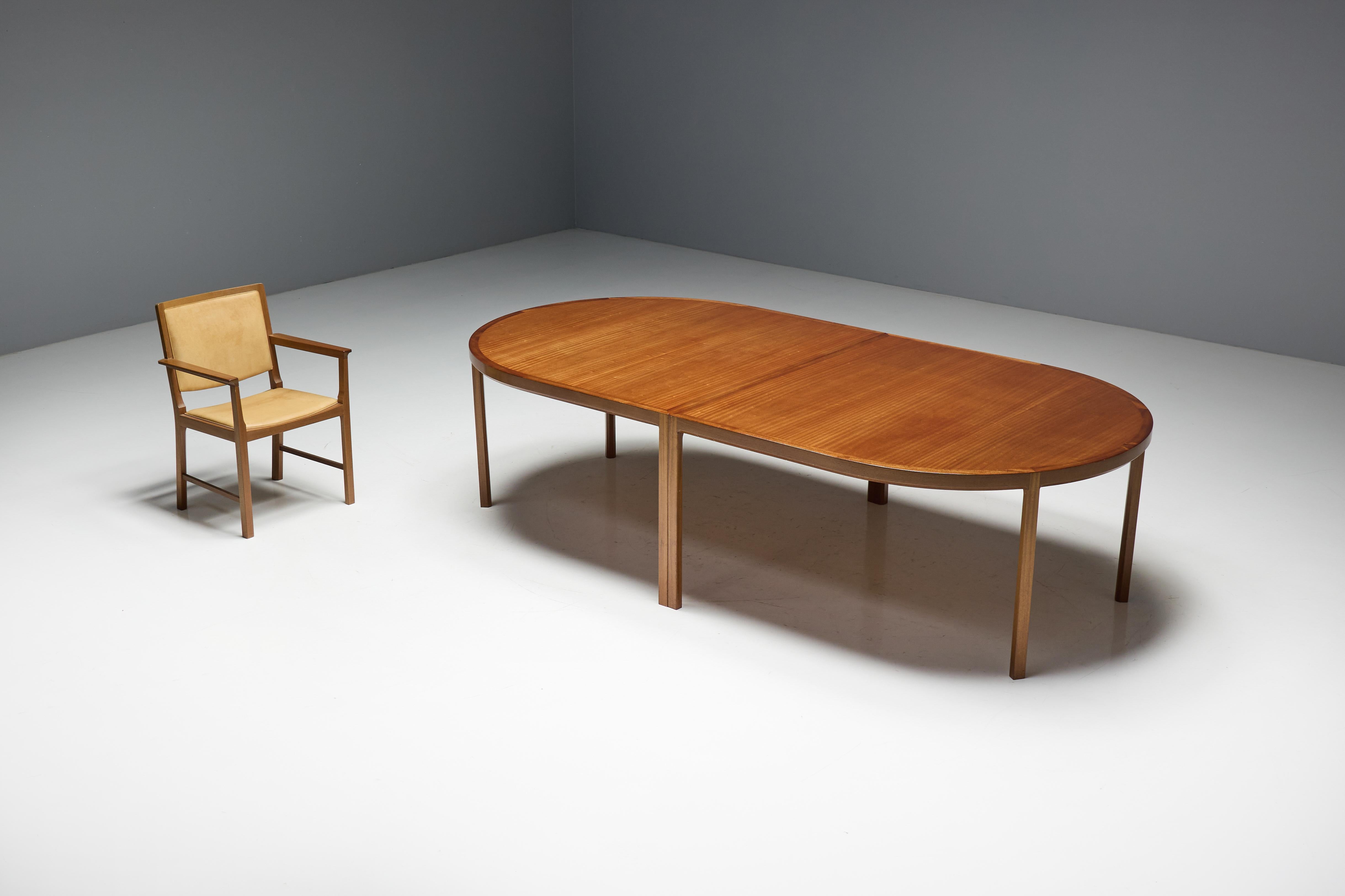 Scandinavian modern table from the 1970s, perfectly complementing the natural elegance of the leather-upholstered chairs. Crafted from high-quality wood, the table’s sleek design embodies minimalist Scandinavian aesthetics. It is cleverly