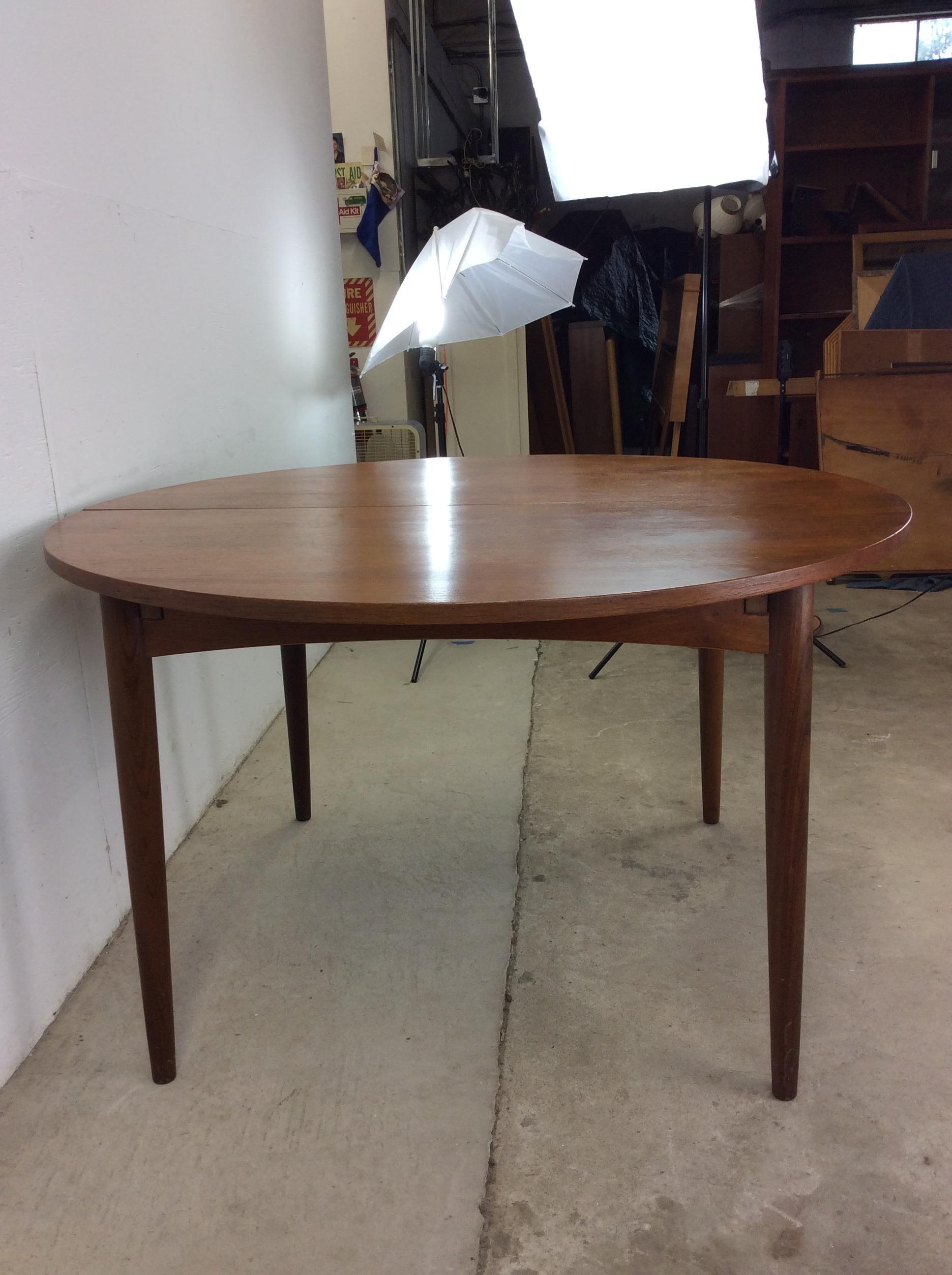 Teak Scandinavian Modern Dining Table with Stowaway Leaf For Sale