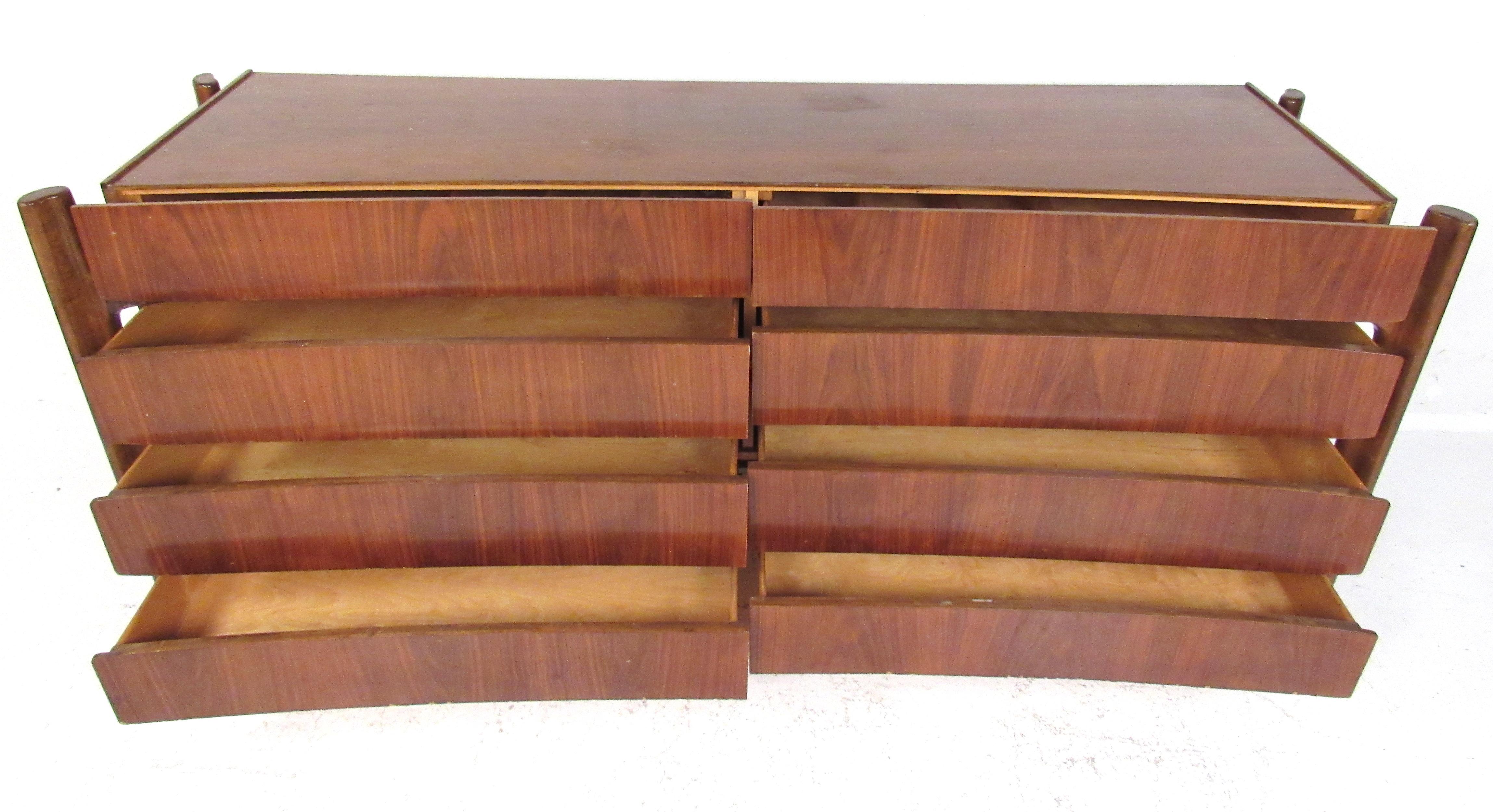 Rare low dresser and chest with top cabinet by William Hinn. Featuring curved fronts with unique exposed carved walnut legs and a bookmatched front. Beautiful and sculptural, this eye-catching design makes the perfect centerpiece for any modern