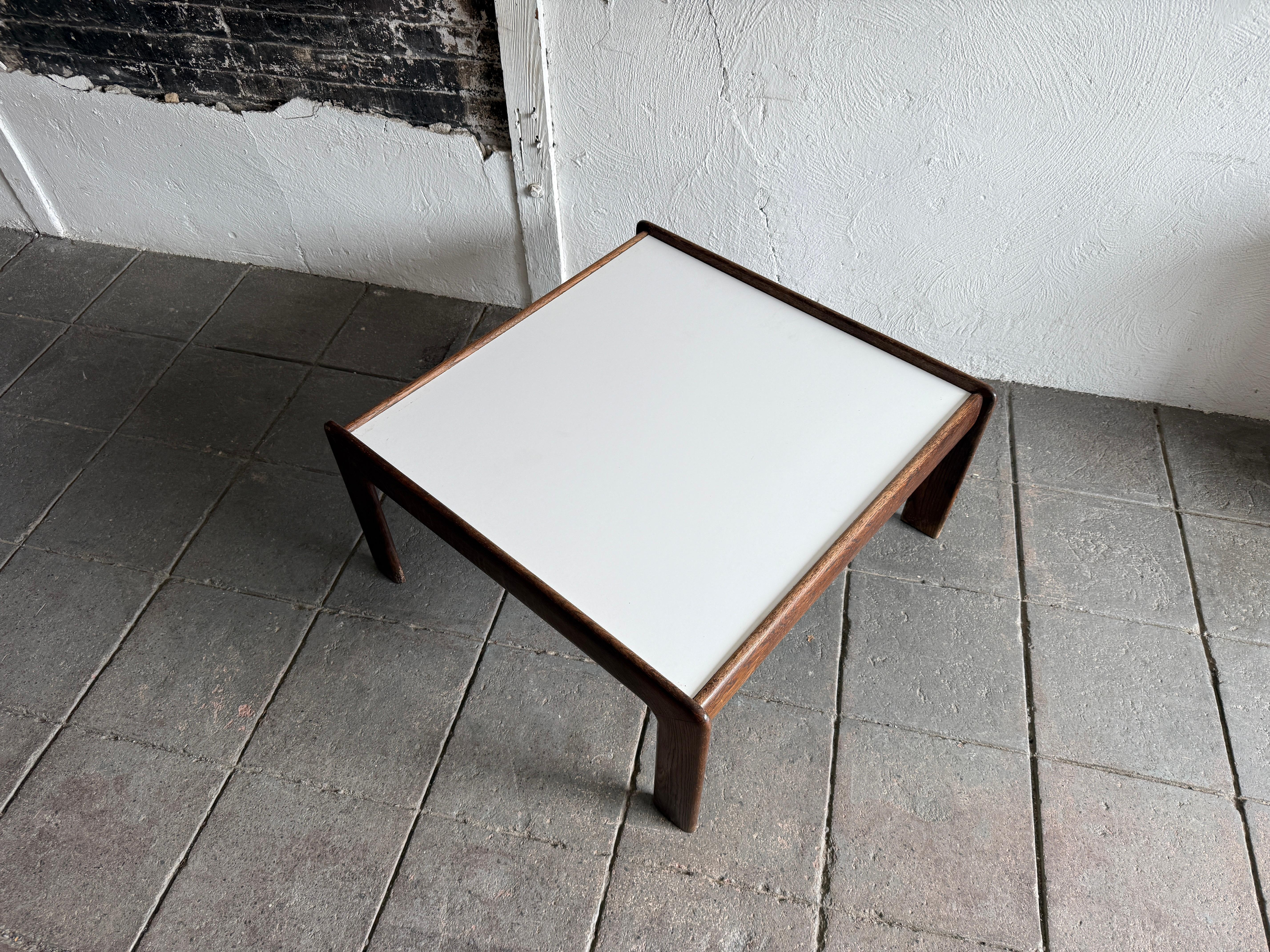 Scandinavian modern Dutch oak and white laminate square coffee table. Circa 1970's White laminate table top curved brown Oak frame. 

Dimensions: H 16