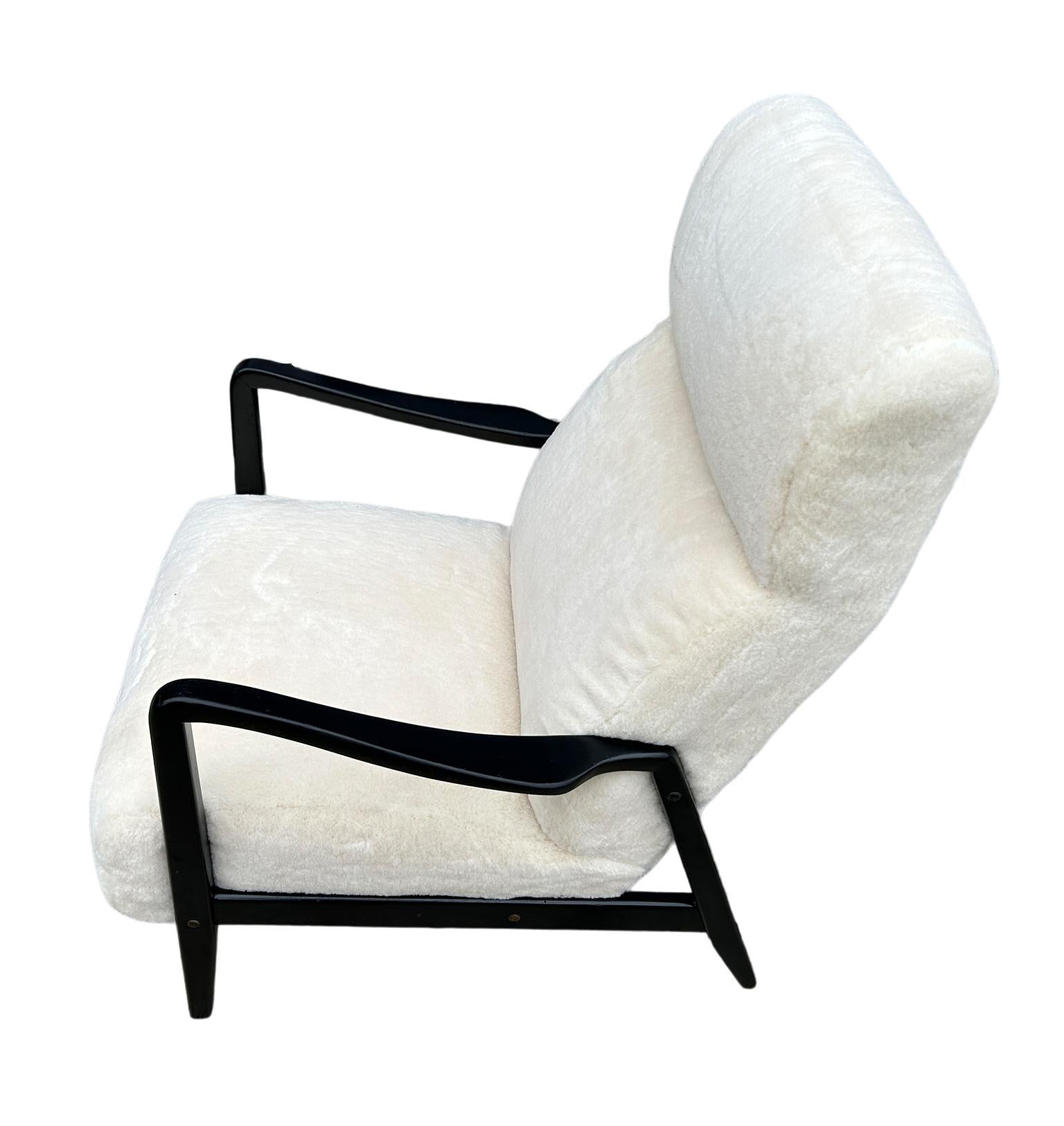 Scandinavian Modern Duxello lounge easy Chair for DUX by Folke Ohlsson in sherpa. Very comfortable Easy Loung chair with Black Lacquered hardwood arms and Newly Upholstered in White shearling sherpa wool. Made By DUX Designed By Folke Ohlsson.