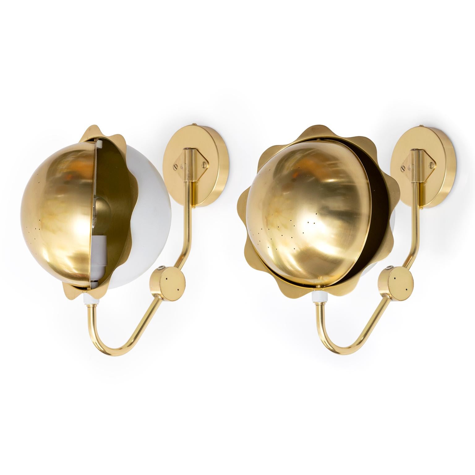 Edvard Hagman AB pair of Eclipse sconces with adjustable shade and rotatable sphere. Newly polished and lacquered the pair have been wired for use in the USA and are mountable to a standard J-box. The sconces are made in Sweden, circa