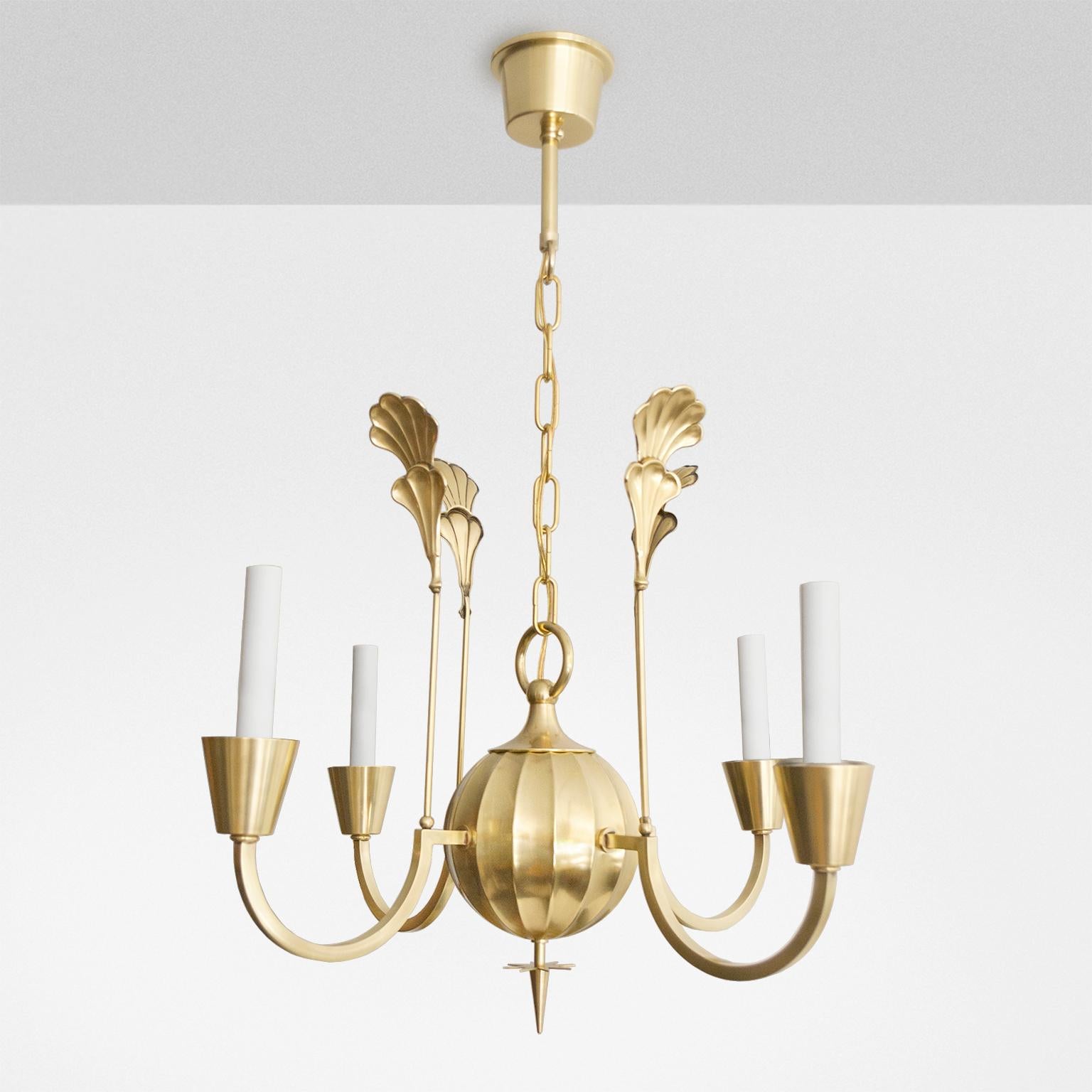 An elegant Swedish Art Deco polished 4-arm brass chandelier designed by Elis Bergh for C.G. Hallberg silversmith, Stockholm, Sweden circa 1925. Newly restored, polished and lacquered, and newly electrified with candelabra base sockets for use in