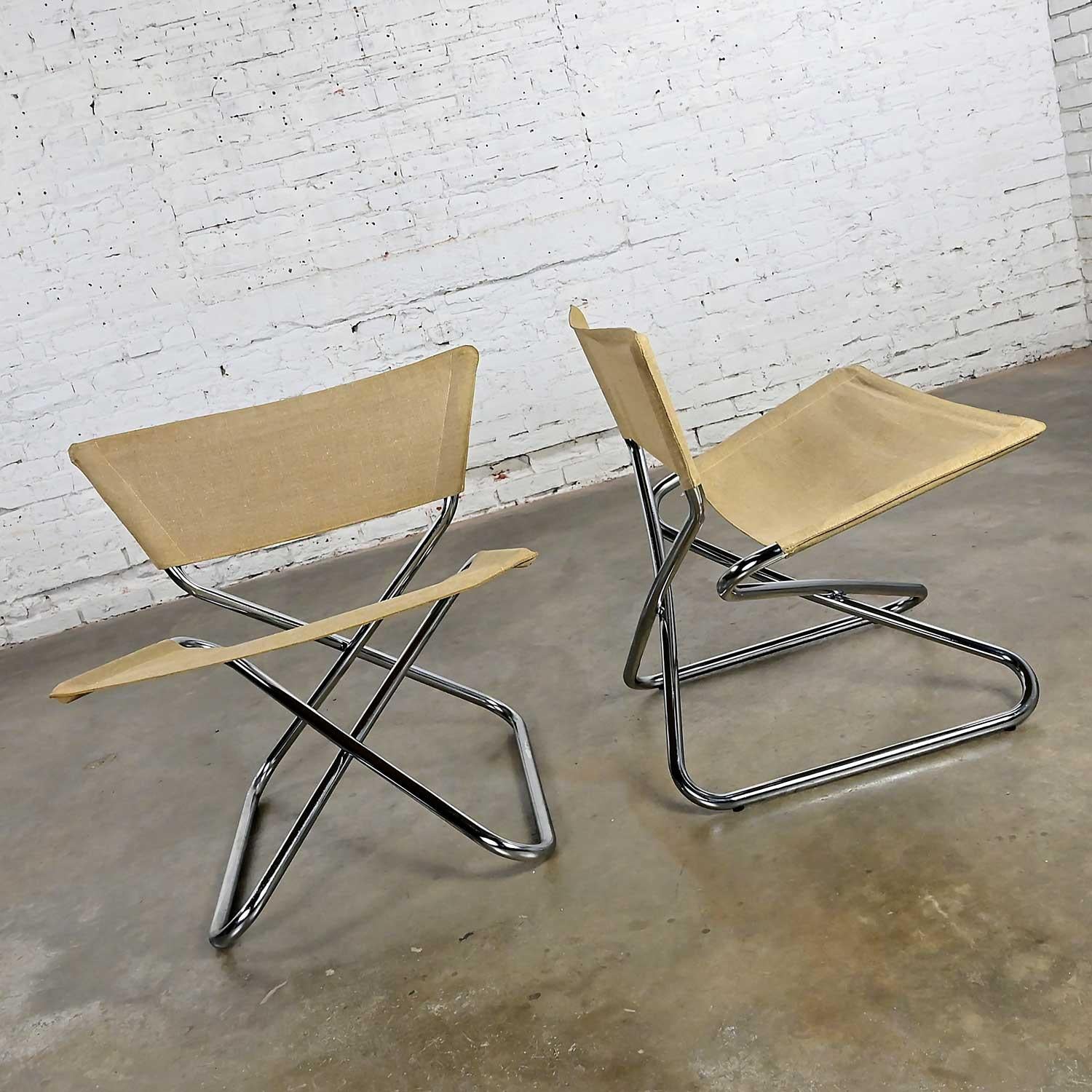 Impressive vintage Scandinavian Modern Erik Magnussen Z Down folding chairs by Torben Orzkov in Denmark, a pair. Comprised of chrome tube frames and natural canvas. Beautiful condition, keeping in mind that these are vintage and not new so will have