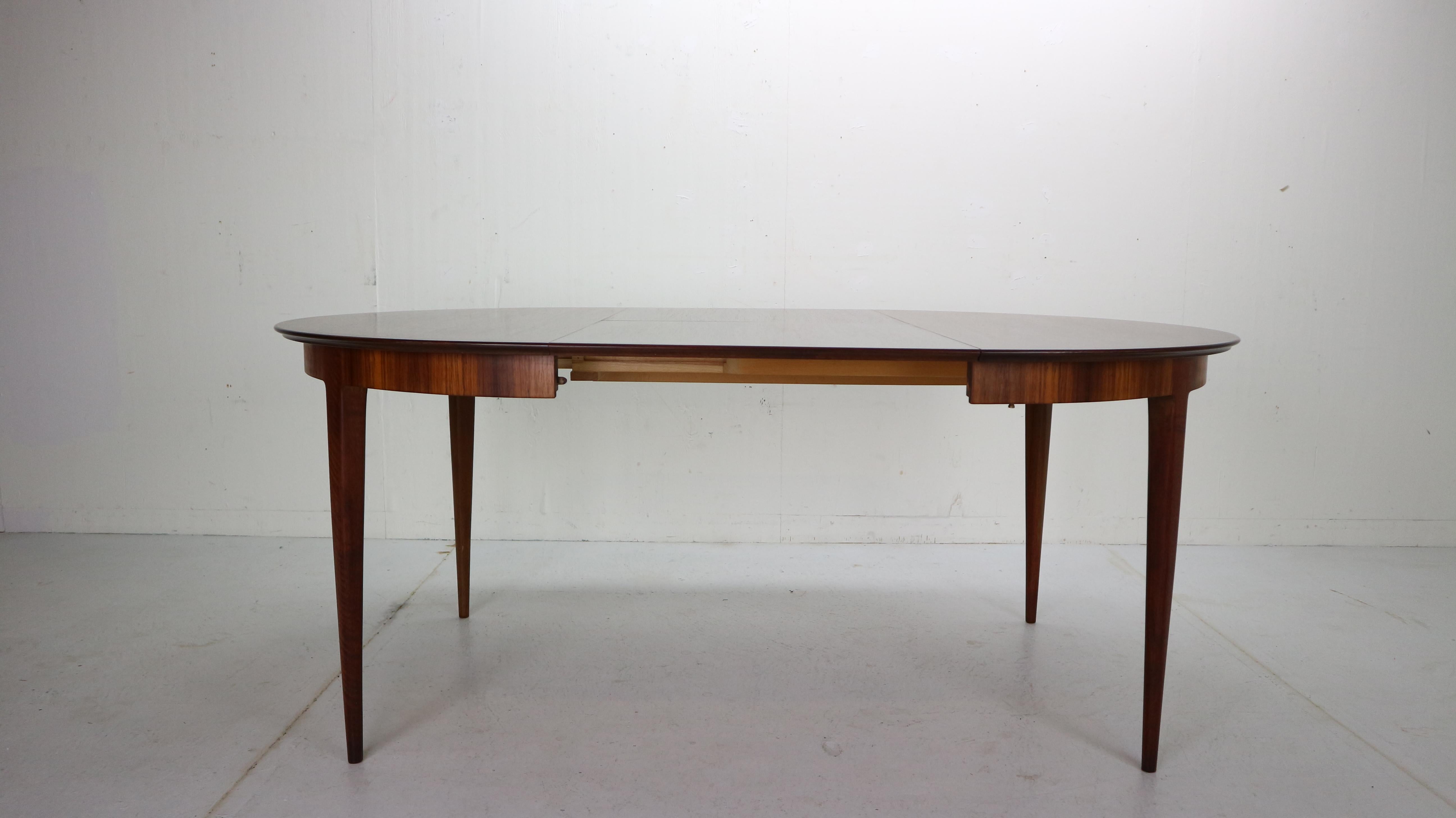 Scandinavian Modern period extendable dining table made in 1960s period, Denmark.
Stunning dining table has an elegant table feet and beautiful wooden pattern round and oval (then extended) tabletop.
This table is extendable from 120cm -