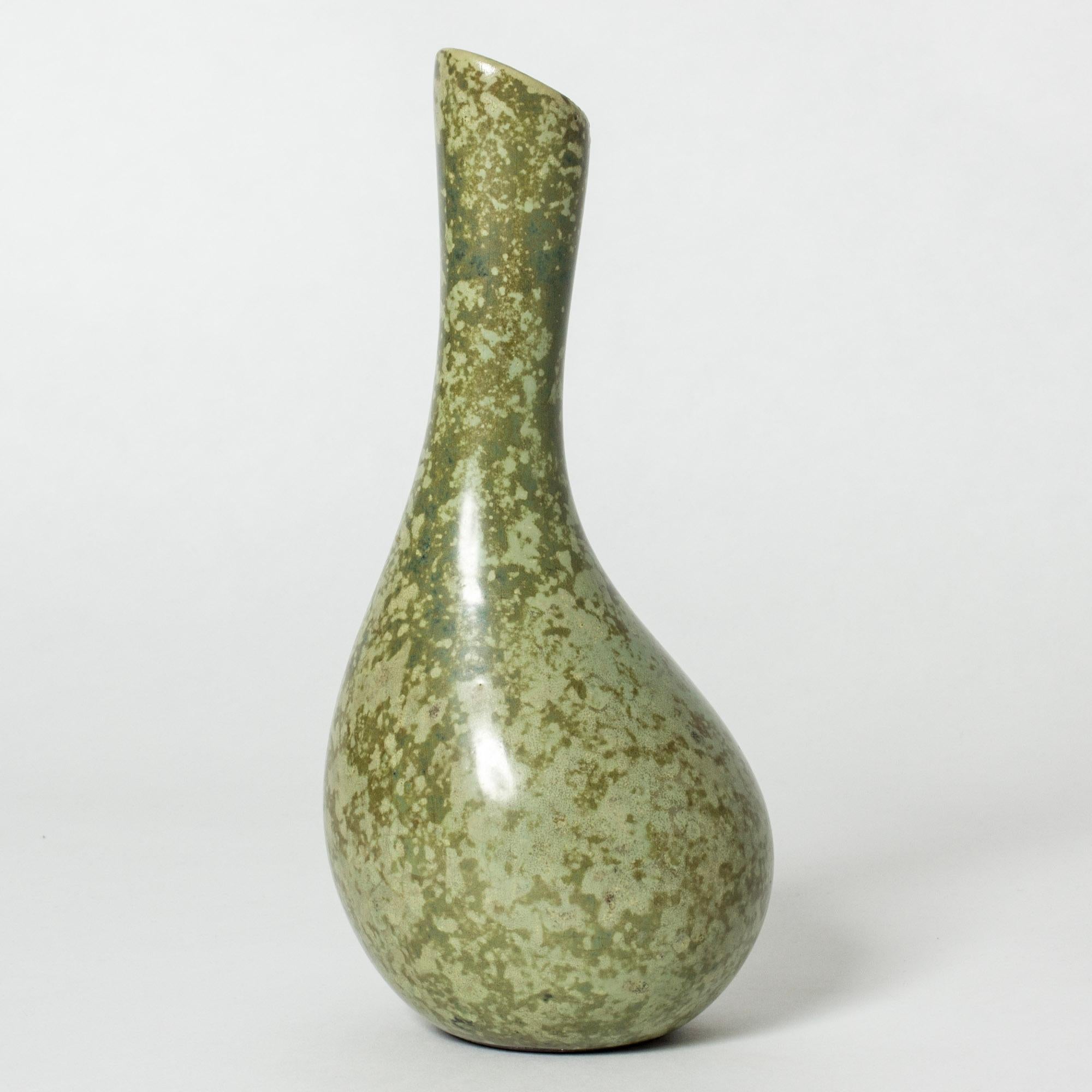 Lovely vase by Hans Hedberg, made in faience. Striking organic form with olive colored glaze and litchen-like flecks.