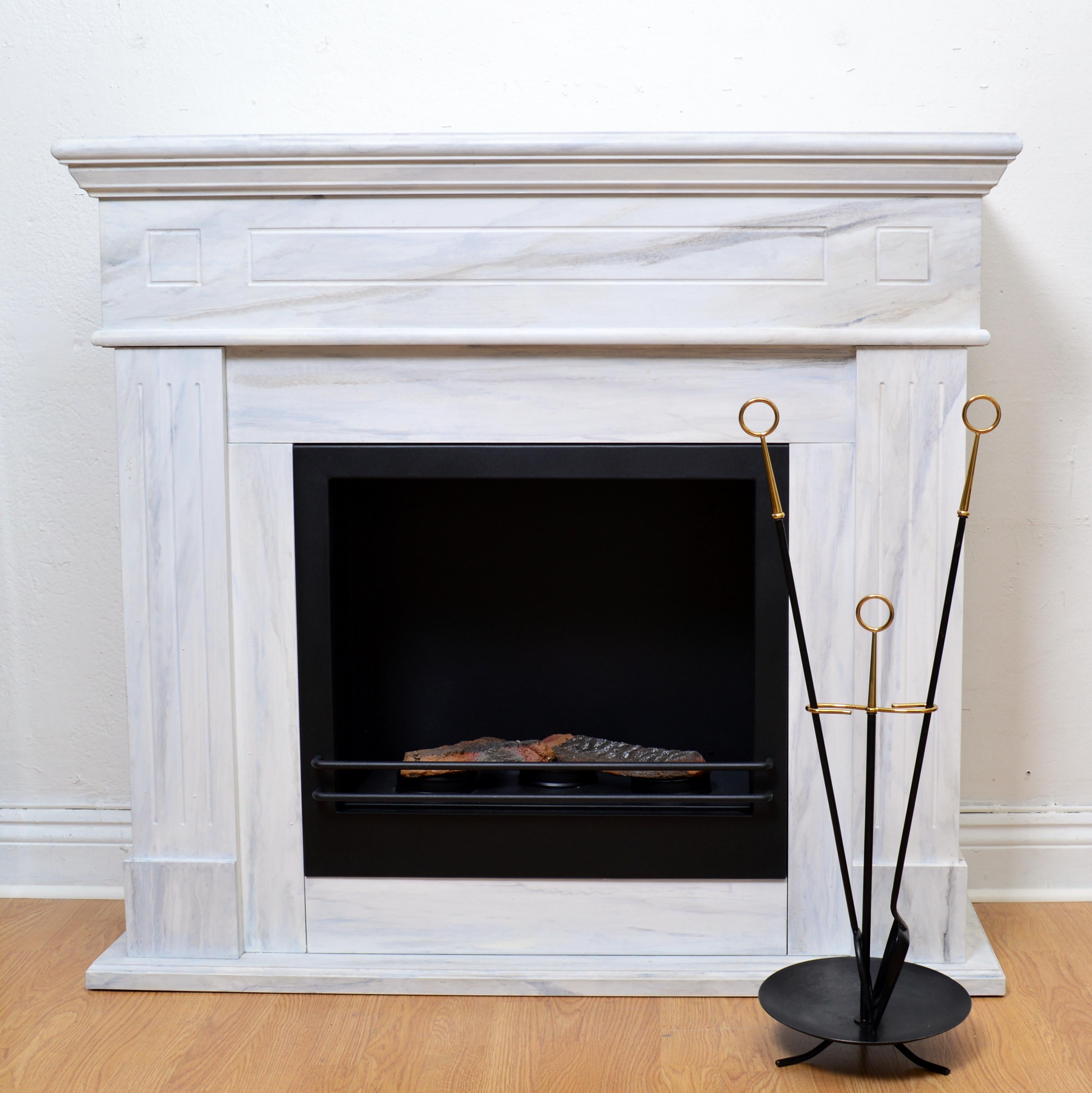 Rare set of fireplace tools designed by Gunnar Ander for Ystad Metall, Sweden, 1960s. Beautiful set in brass and metal, typical for Gunnar Ander's designs. Condition: Original condition with signs of use and age.
 