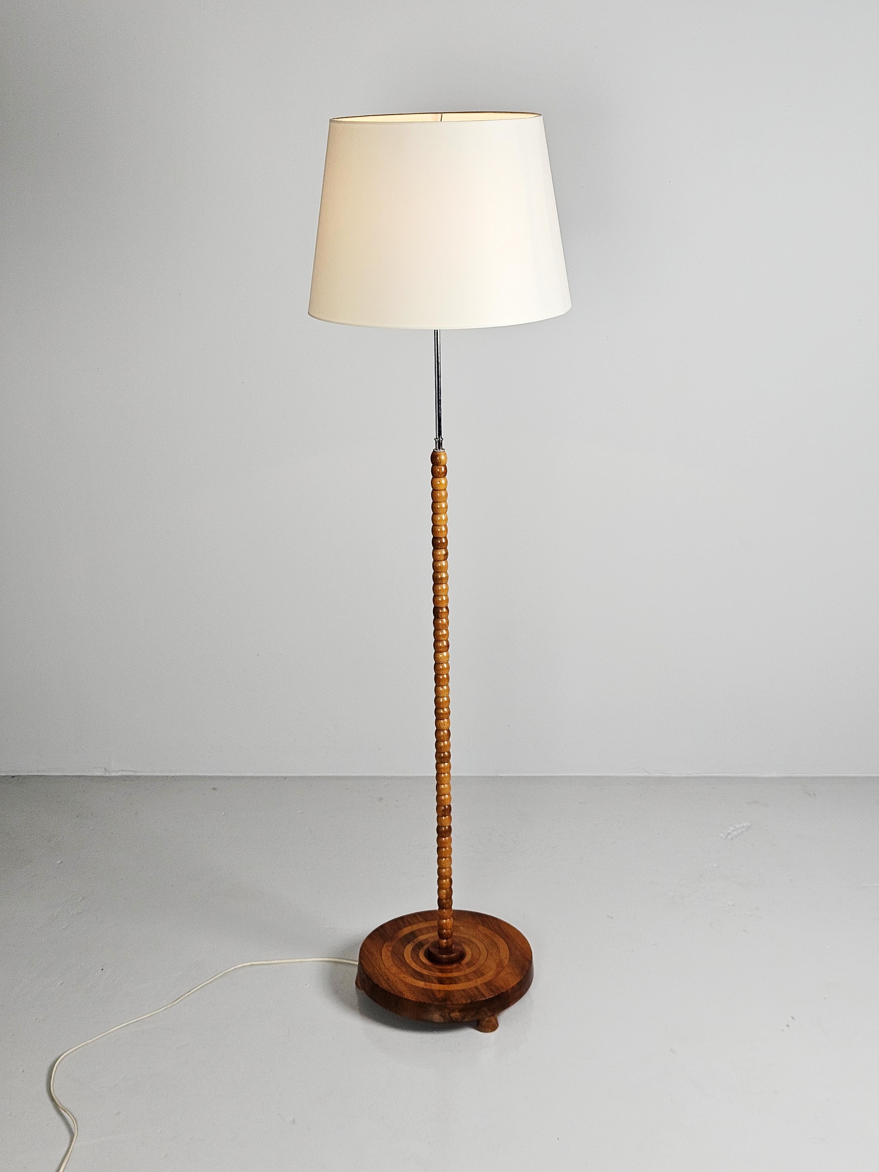 Beautiful Swedish modern floor lamp made in the middle of the 20th century. 

Modernistic design with steel and Great wood details.