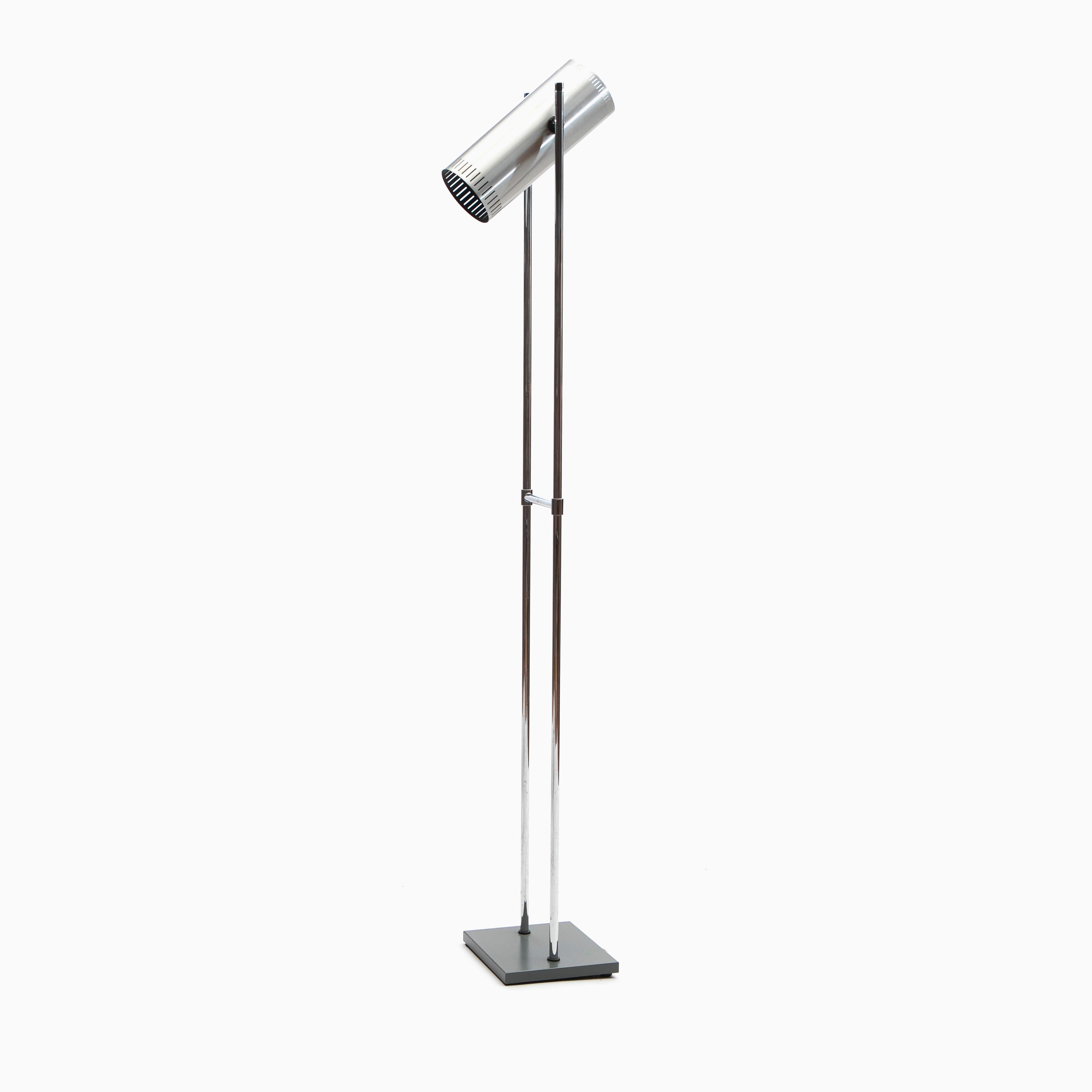 The classic midcentury Trombone floor lamp designed by Jo Hammerborg for Fog and Morup, Denmark, 1970s.

Adjustable shade made of aluminum with brush steel look.
The legs are of chromium-plated metal and the lamp foot is of metal with grey