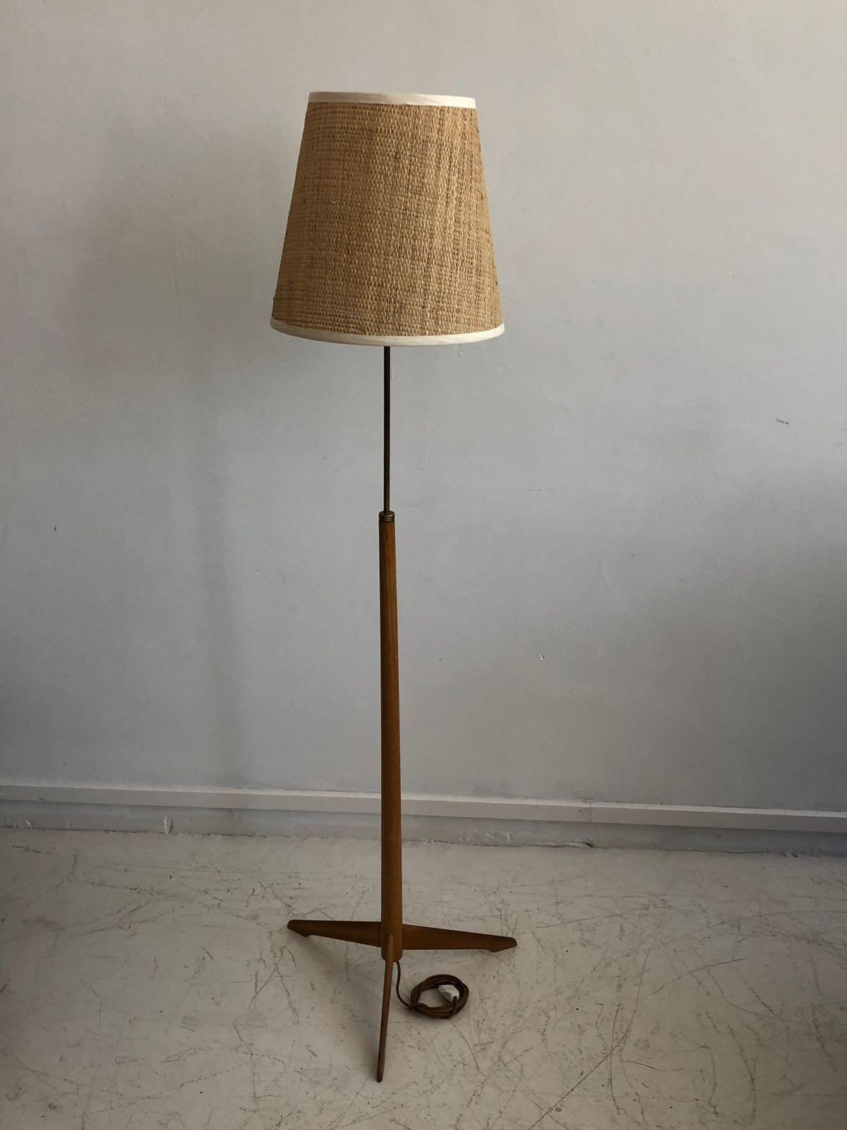 Swedish mid-20th century floor lamp, model G-34, produced by Bergboms. Wooden stand with metal parts and a rattan screen.