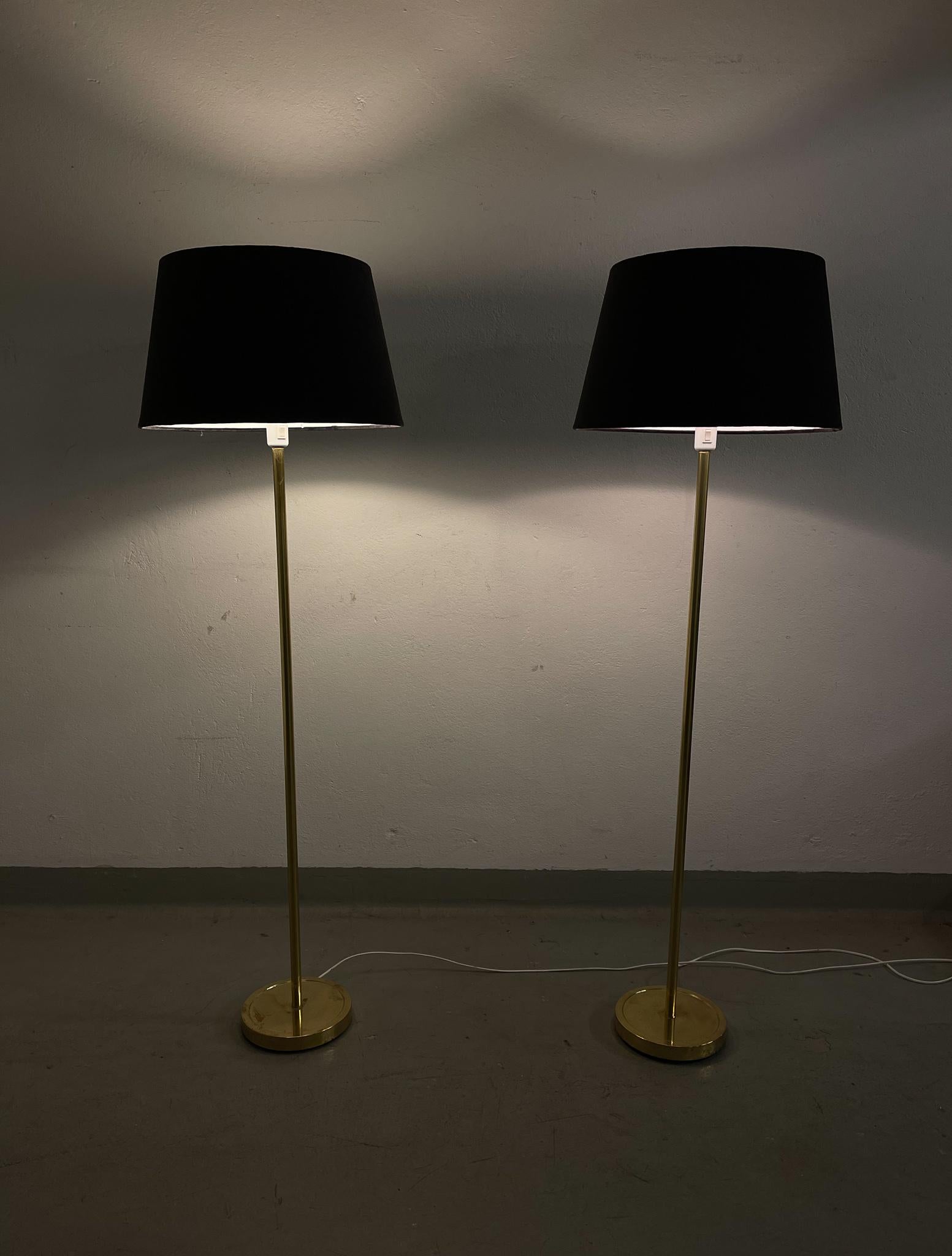 A pair of floor lamps in brass produced in Sweden during the 1970s by ENCO. 

Good vintage condition with some marks and darker details on the brass base. All new wiring. The shade is new and if byer want, they can be included. 

Dimensions: H