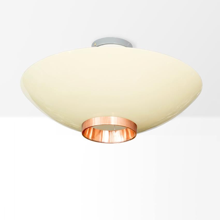 A Scandinavian Modern flush mount fixture from Itsu, Finland. The painted structure supports a warm white cased glass shade which in turn is held in place by a polished copper ring. Newly rewired for use in the USA with a single Edison base