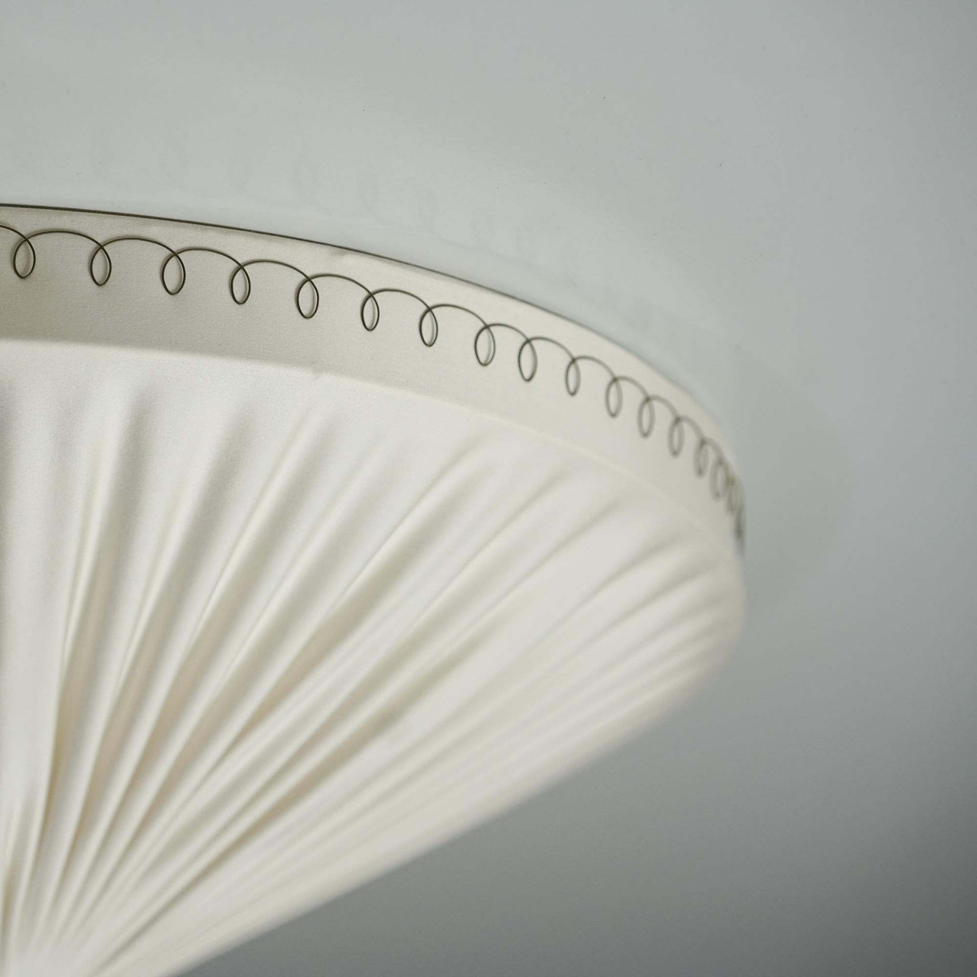 Scandinavian Modern flush mount, manufactured in Finland, 1950s. Reupholstered with quality Lauritzon 