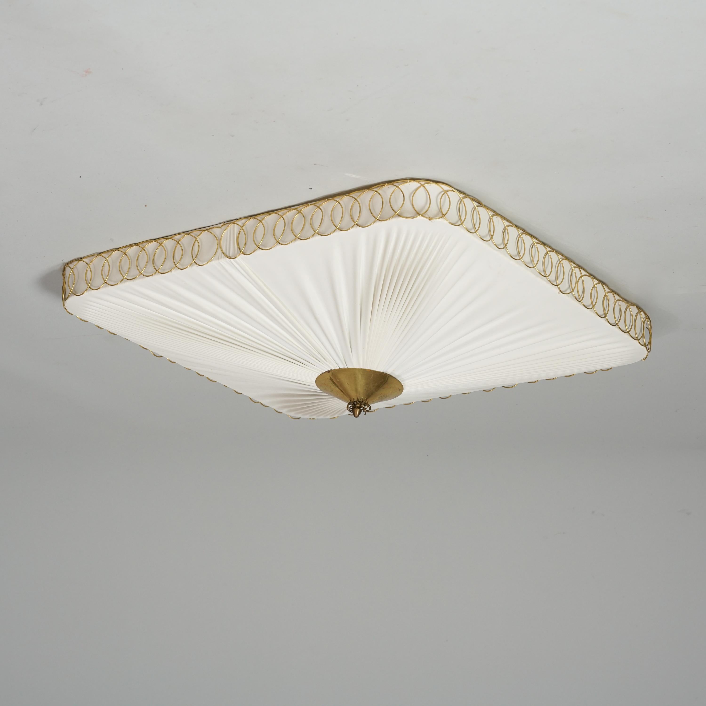 Scandinavian Modern flush mount model 11025 by Idman Oy Finland, from the 1950s. Fabric shade, brass details. Good vintage condition, patina and wear consistent with age and use. Classic Idman design.