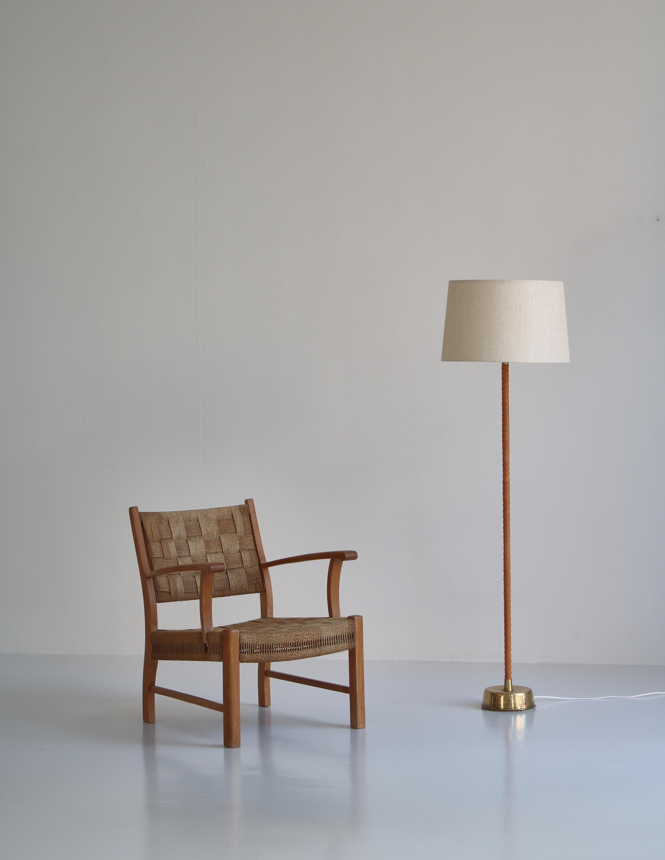 Rare early modernist armchair made at Fritz Hansen, Copenhagen in the 1930s. Attributed to Karl Schröder. Made in solid beechwood and woven seagrass.