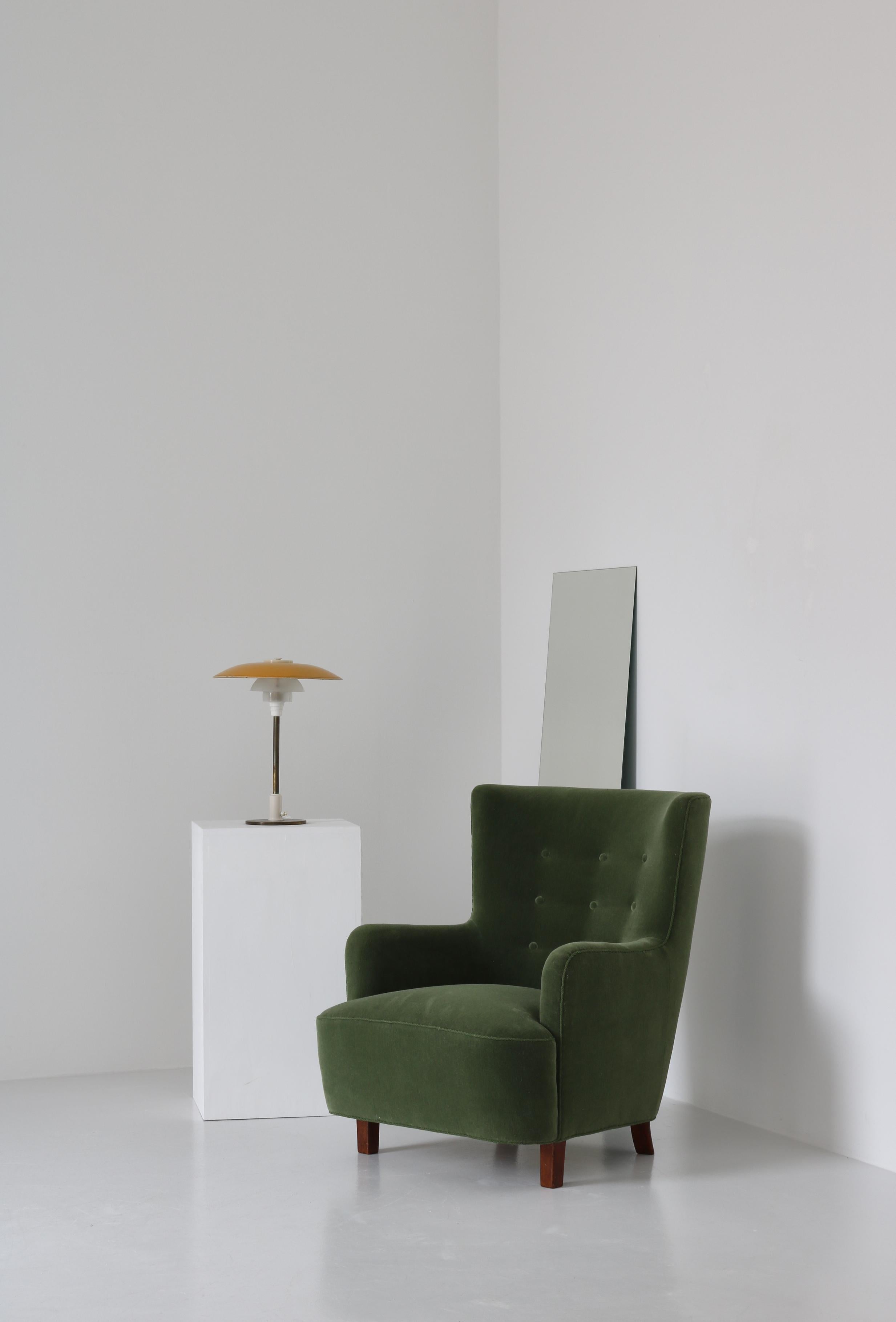 Beautiful Scandinavian Modern easy chair made in Denmark in the 1940s and attributed to Fritz Hansen. Legs in stained beech. The chair has been reupholstered in green mohair velvet.

Grand Mohair by Danish Art Weaving:
Mohair is made from the hair
