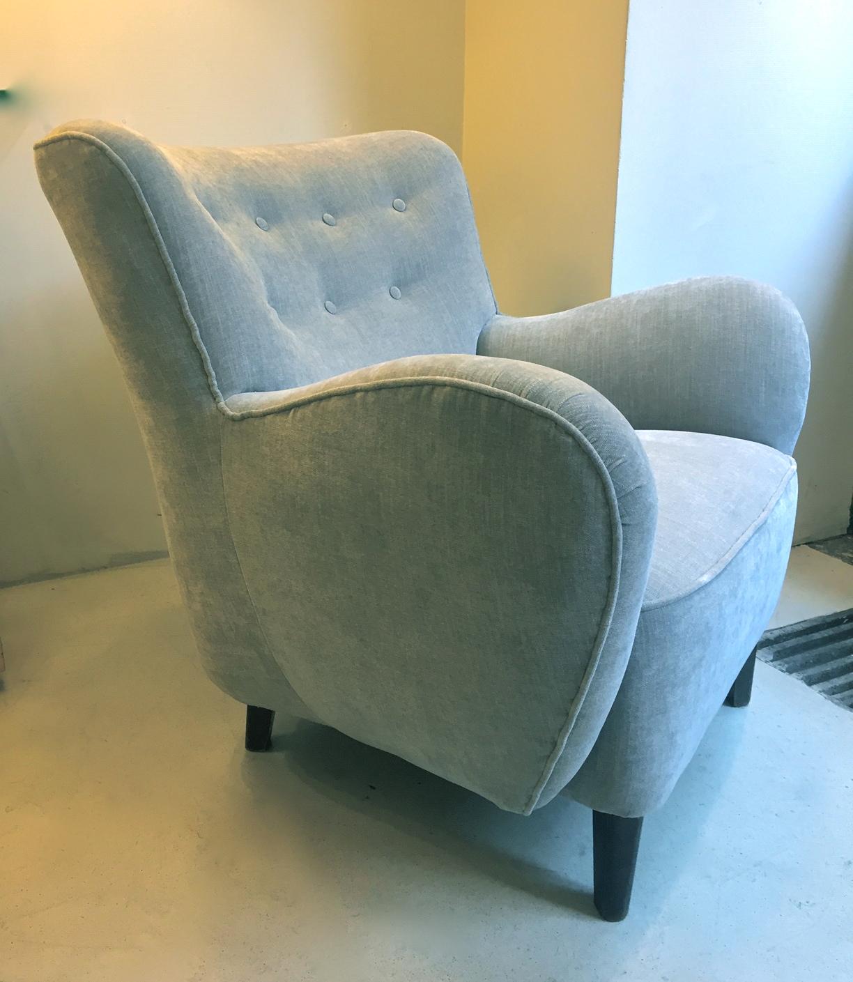 An Scandinavian Modern armchair edited in the 1940s and reupholstered in grey 